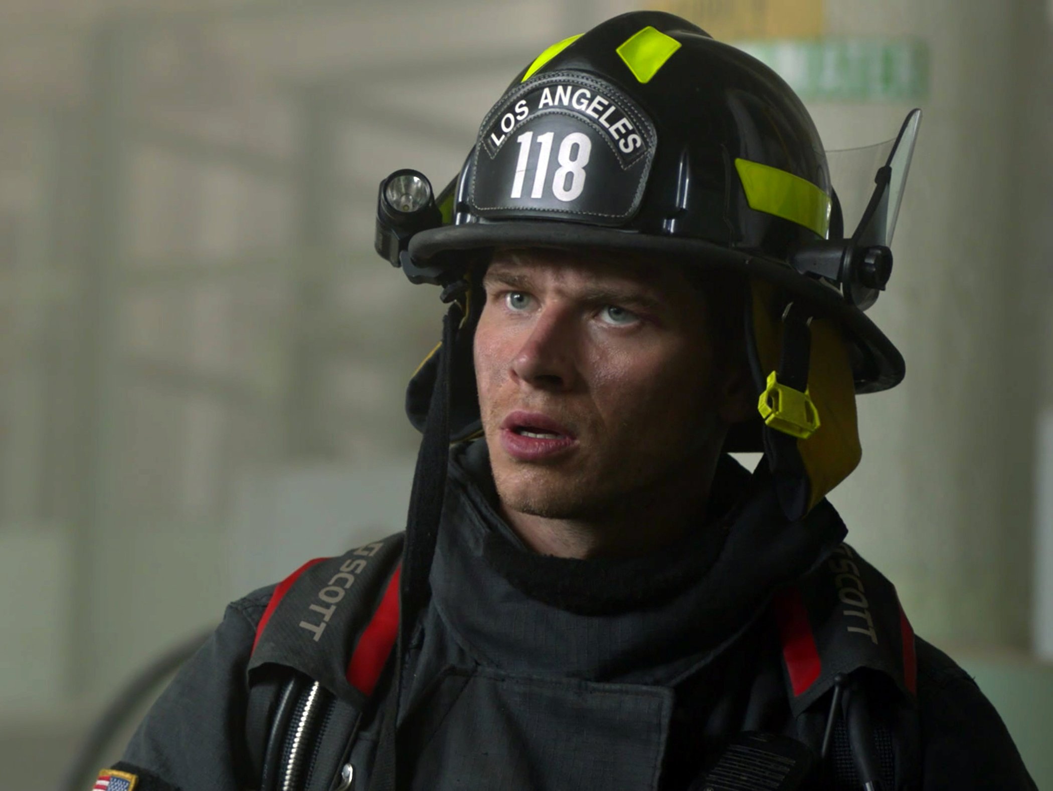 '9-1-1' Season 5 star Evan 'Buck' Buckley in firefighting gear looking surprised