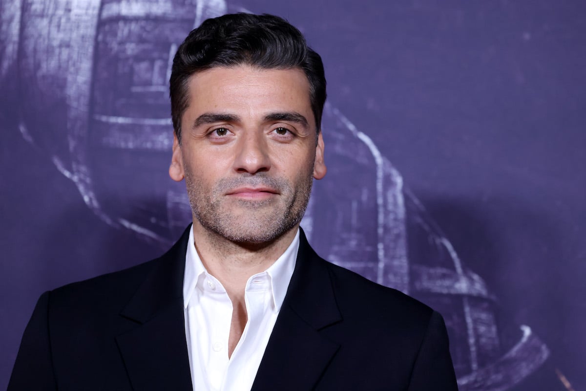 'Moon Knight' star Oscar Isaac wears a suit and poses on the red carpet