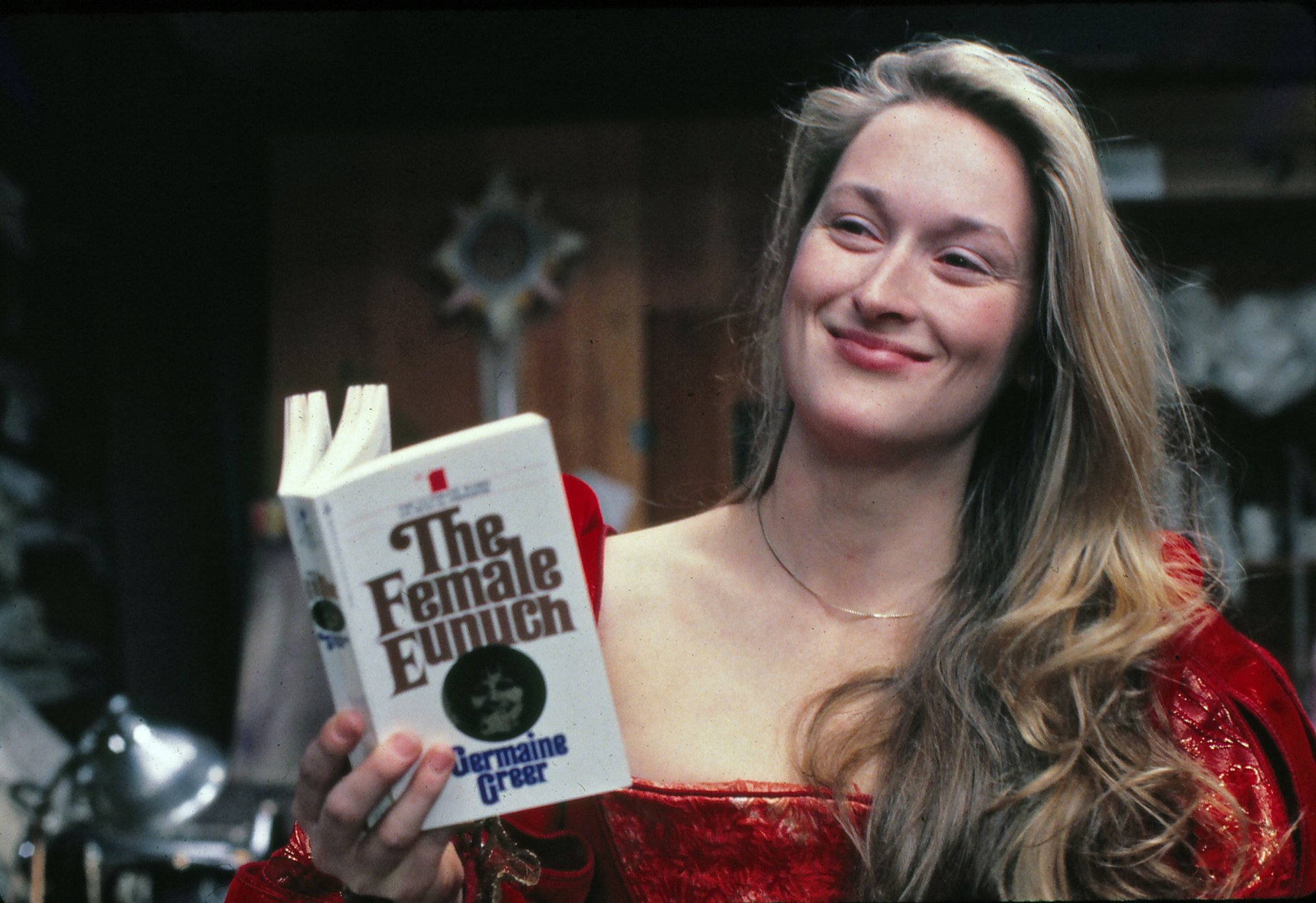 Oscar winner Meryl Streep holding a book and smiling