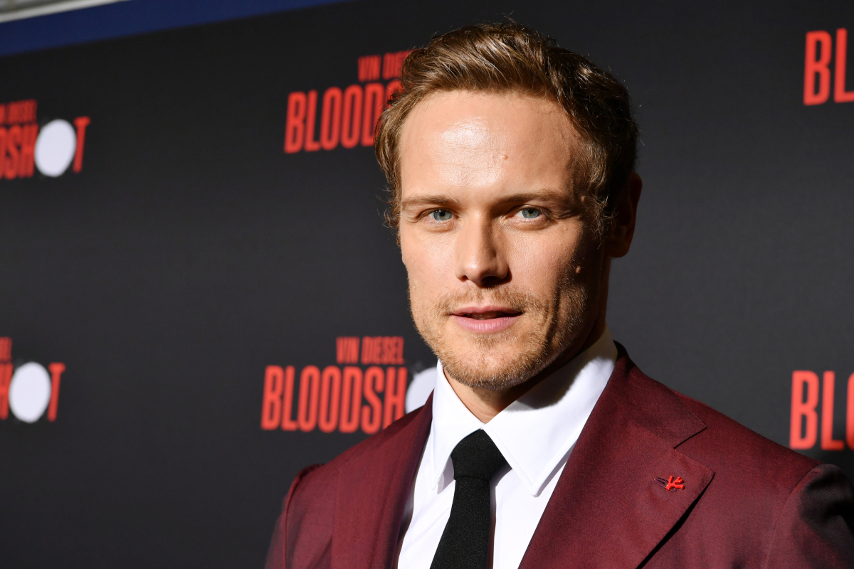 Outlander star Sam Heughan wearing a burgundy suit attends the premiere of Sony Pictures' "Bloodshot" on March 10, 2020 in Los Angeles, California