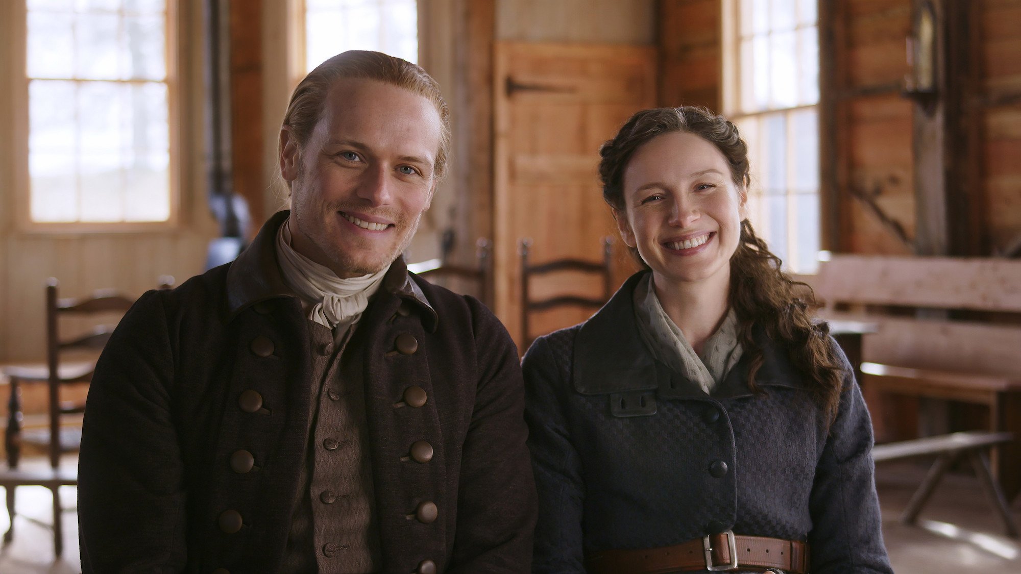 'Outlander': Sam Heughan and Caitriona Balfe smile in the cabin set