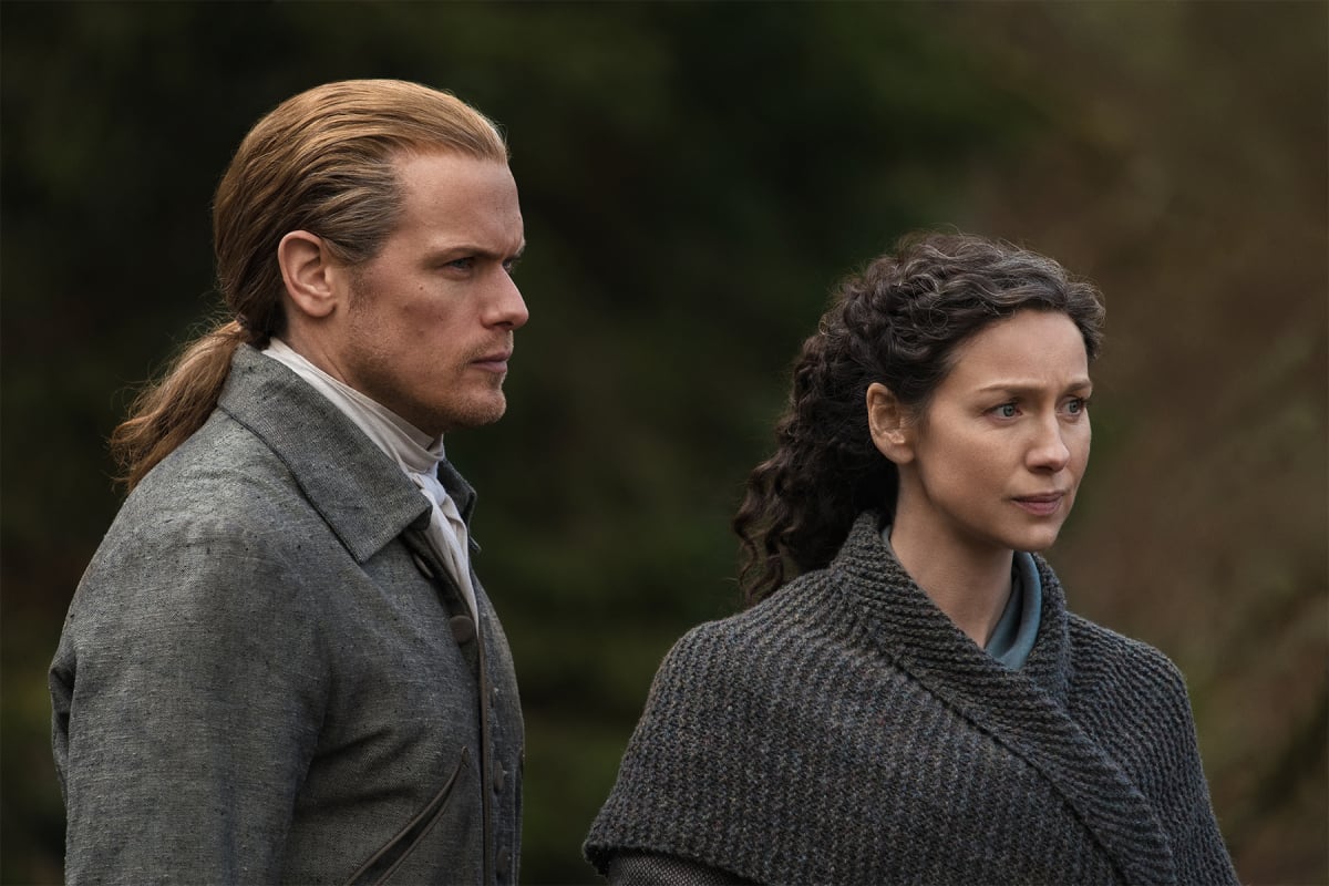 Outlander stars Sam Heughan and Caitriona Balfe in character as Jamie and Claire Fraser in an image from season 6 of the Starz hit
