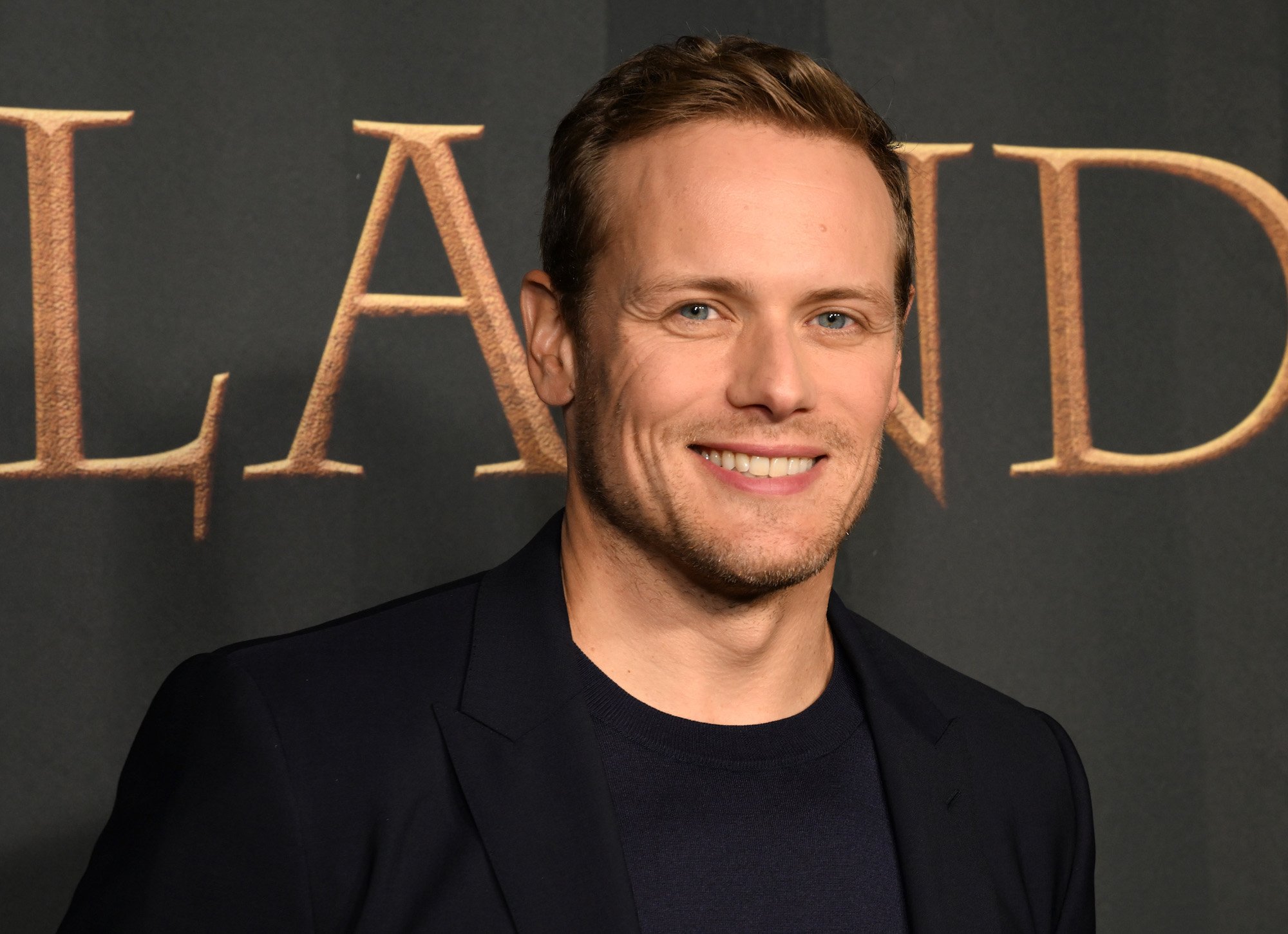 'Outlander' star Sam Heughan smiles on the FYC red carpet