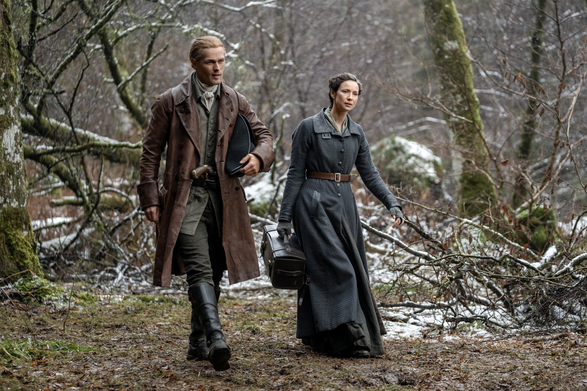 'Outlander': Sam Heughan and Caitriona Balfe walk through the woods