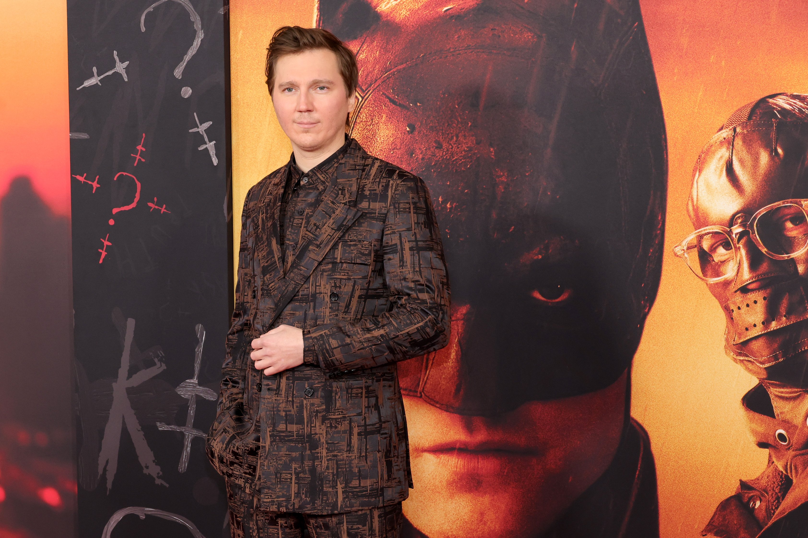 'The Batman' star Paul Dano wears a brown and black suit.