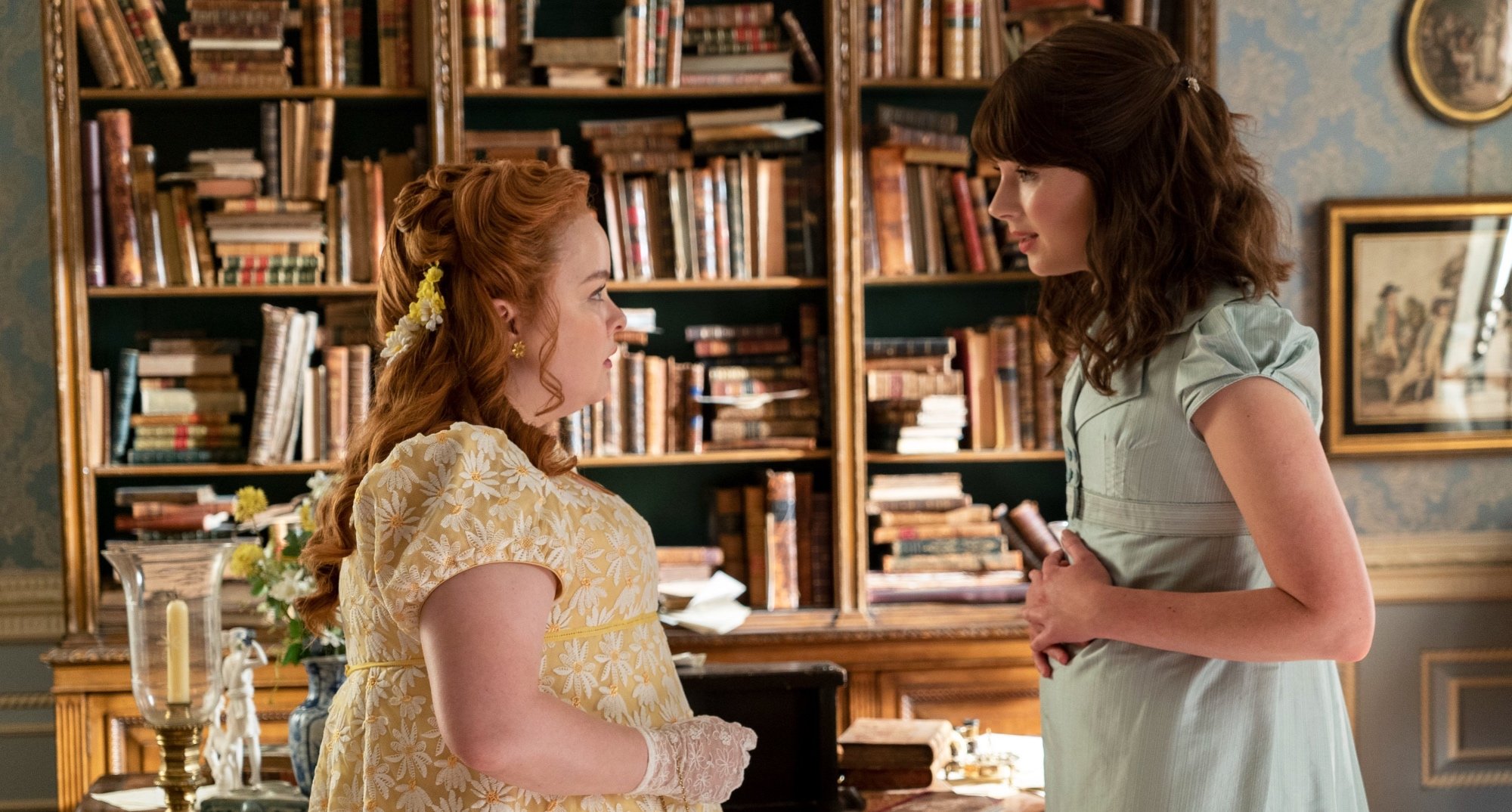 Penelope and Eloise in Shonda Rhimes 'Bridgerton' Season 2 facing each other in room.