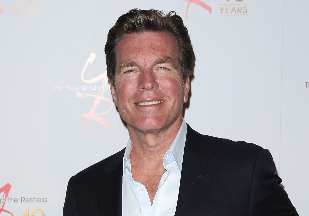'The Young and the Restless' actor Peter Bergman wearing a black suit and white shirt during a red carpet appearance.