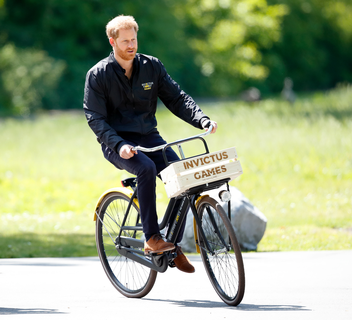 Prince Harry rides a bike