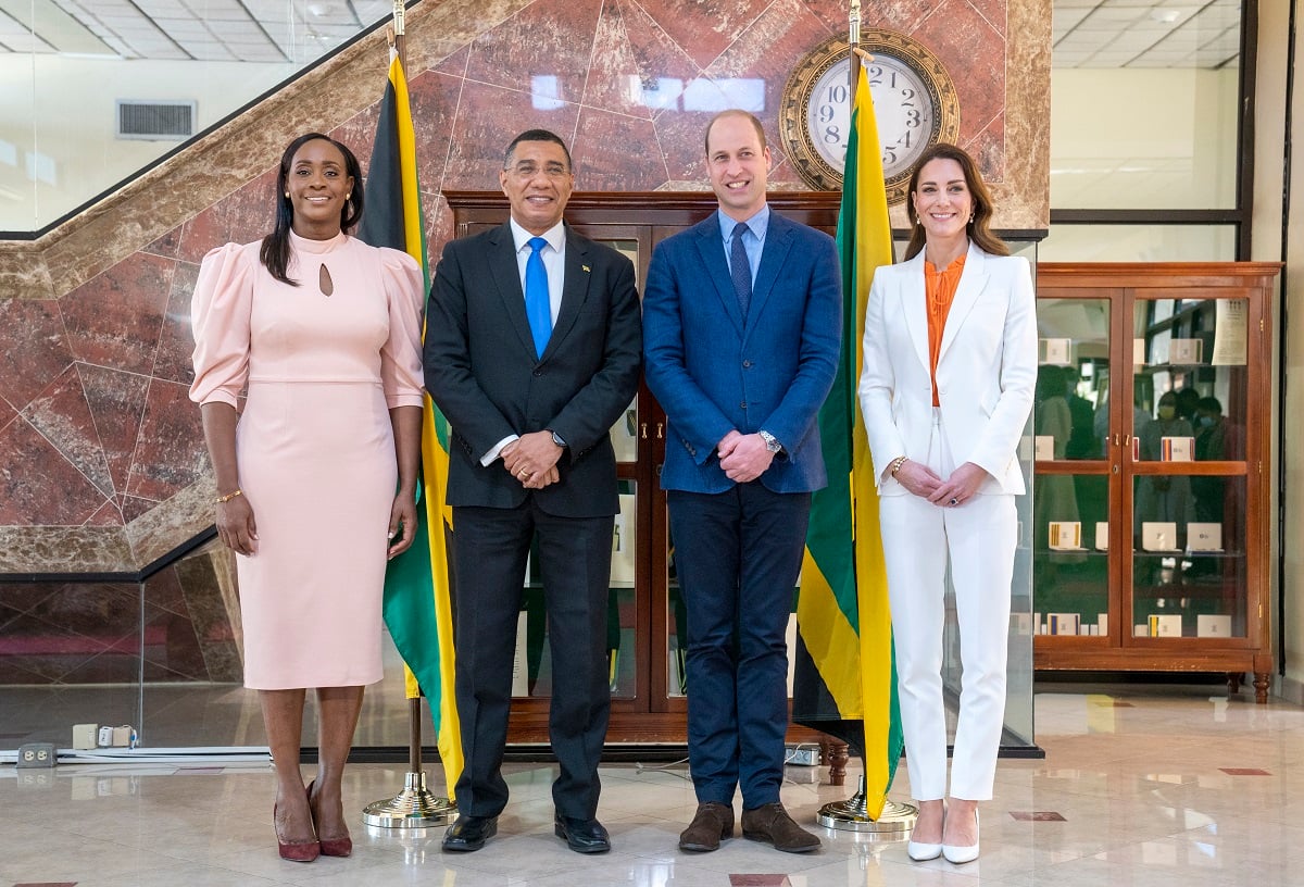 Prince William and Kate Middleton pose for a photo during their visit to the Prime Minister of Jamaica Andrew Holness' office
