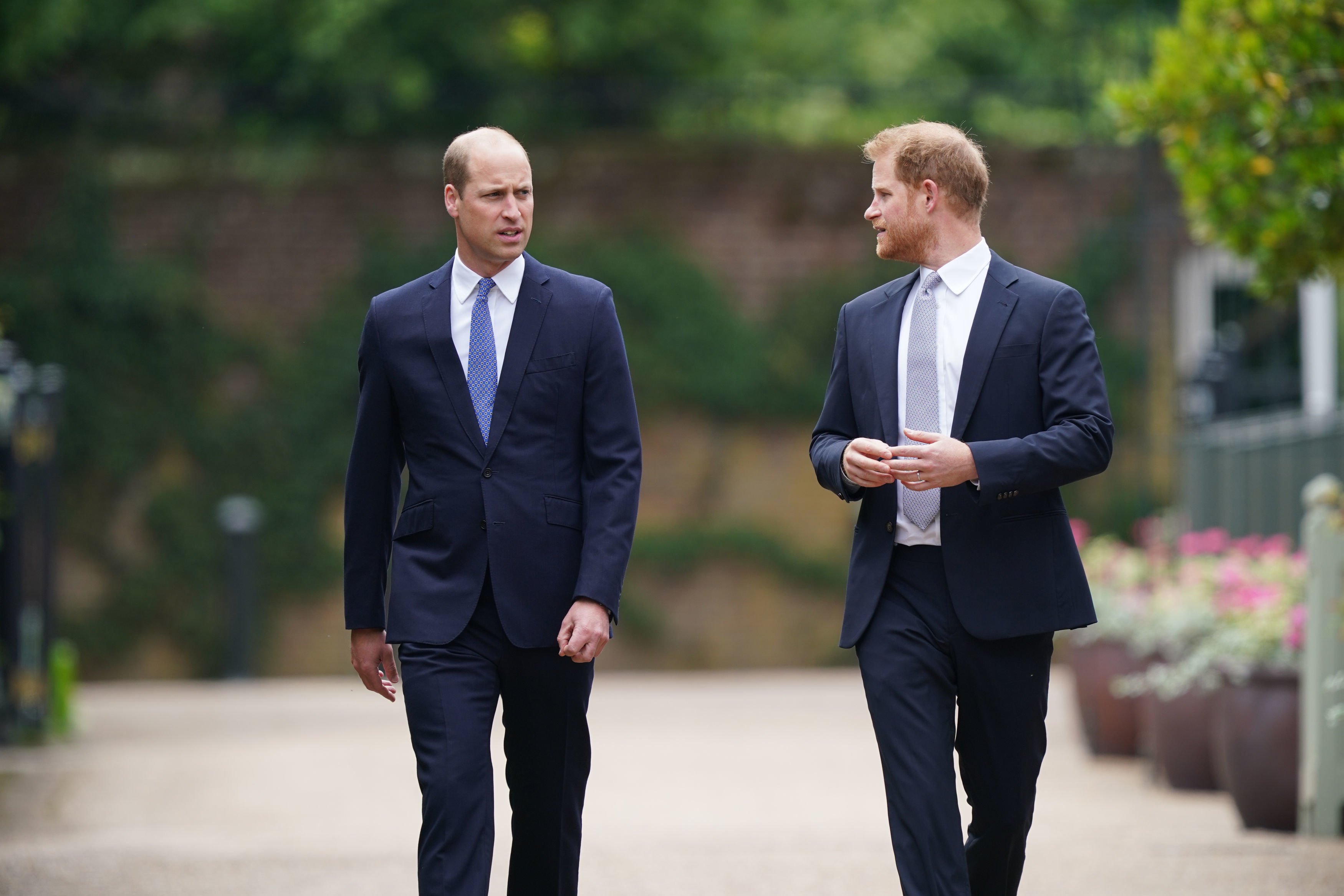 Prince William and Prince Harry arrive for the unveiling of a statue they commissioned of their mother Diana