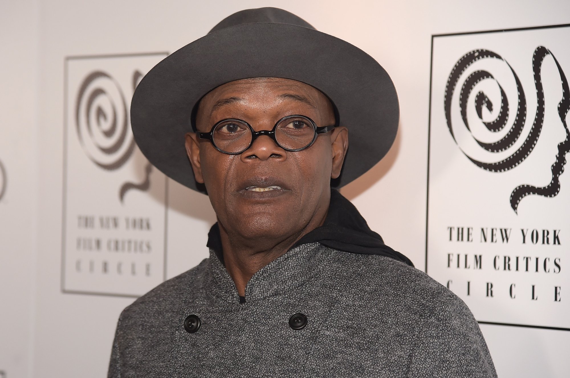 'Pulp Fiction' actor Samuel L. Jackson wearing a hat in front of a step and repeat