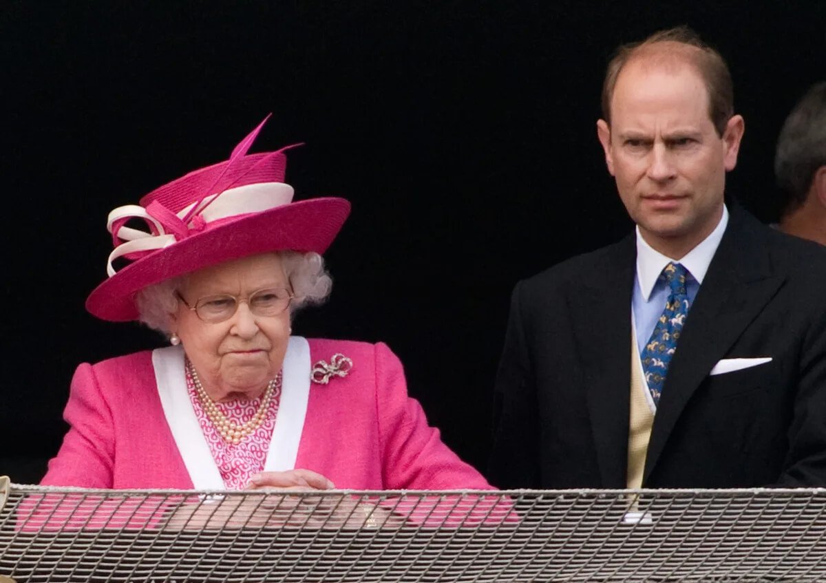Queen Elizabeth II and Prince Edward react after watching the Epsom Derby