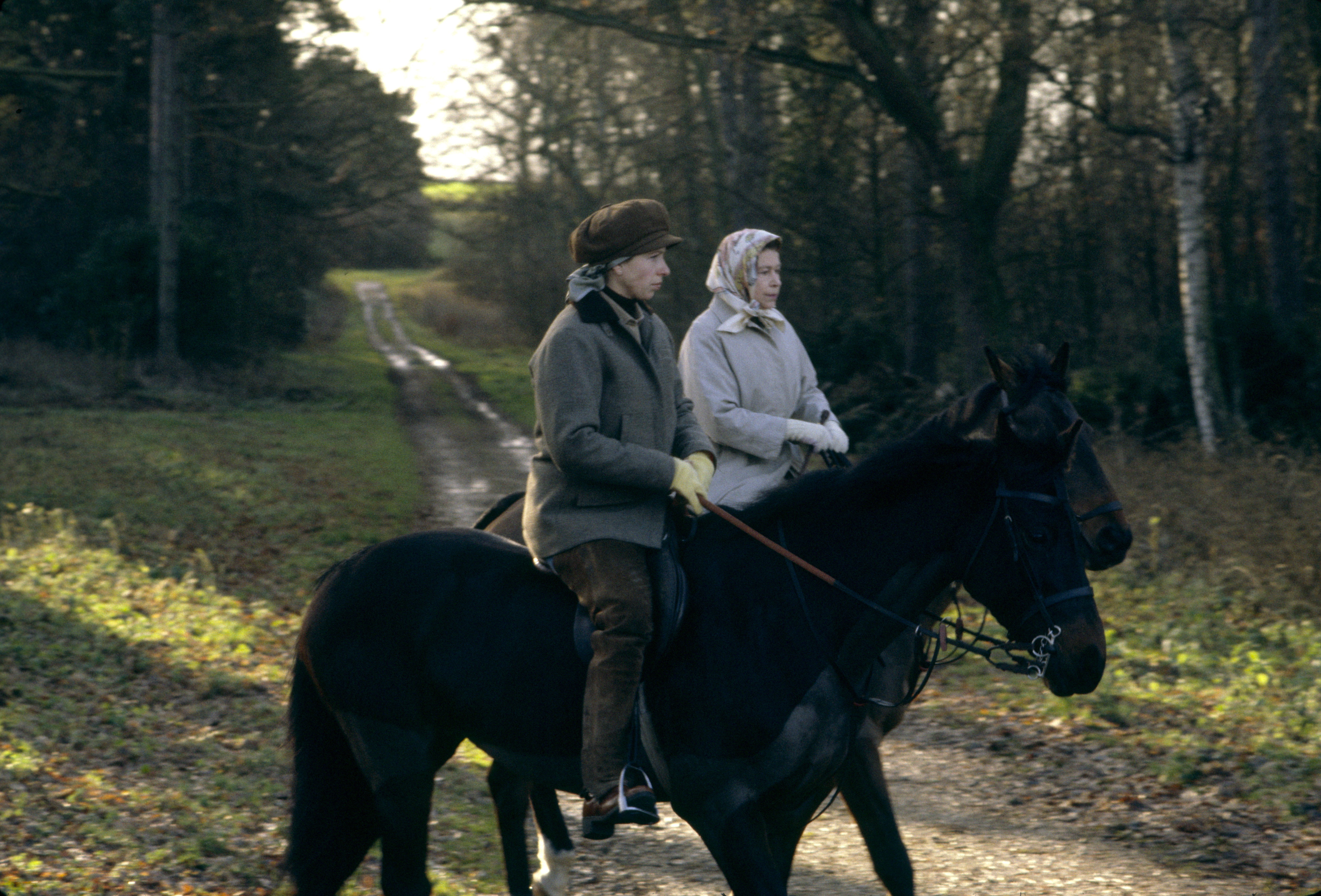 Queen Elizabeth II and Princess Anne riding their horses at Sandringham