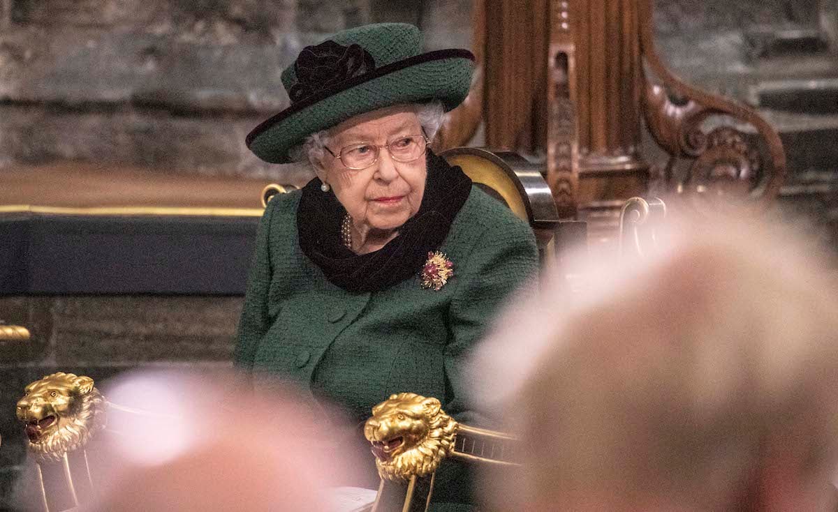 Queen Elizabeth II wears green and black at Prince Philip's memorial service and looks on