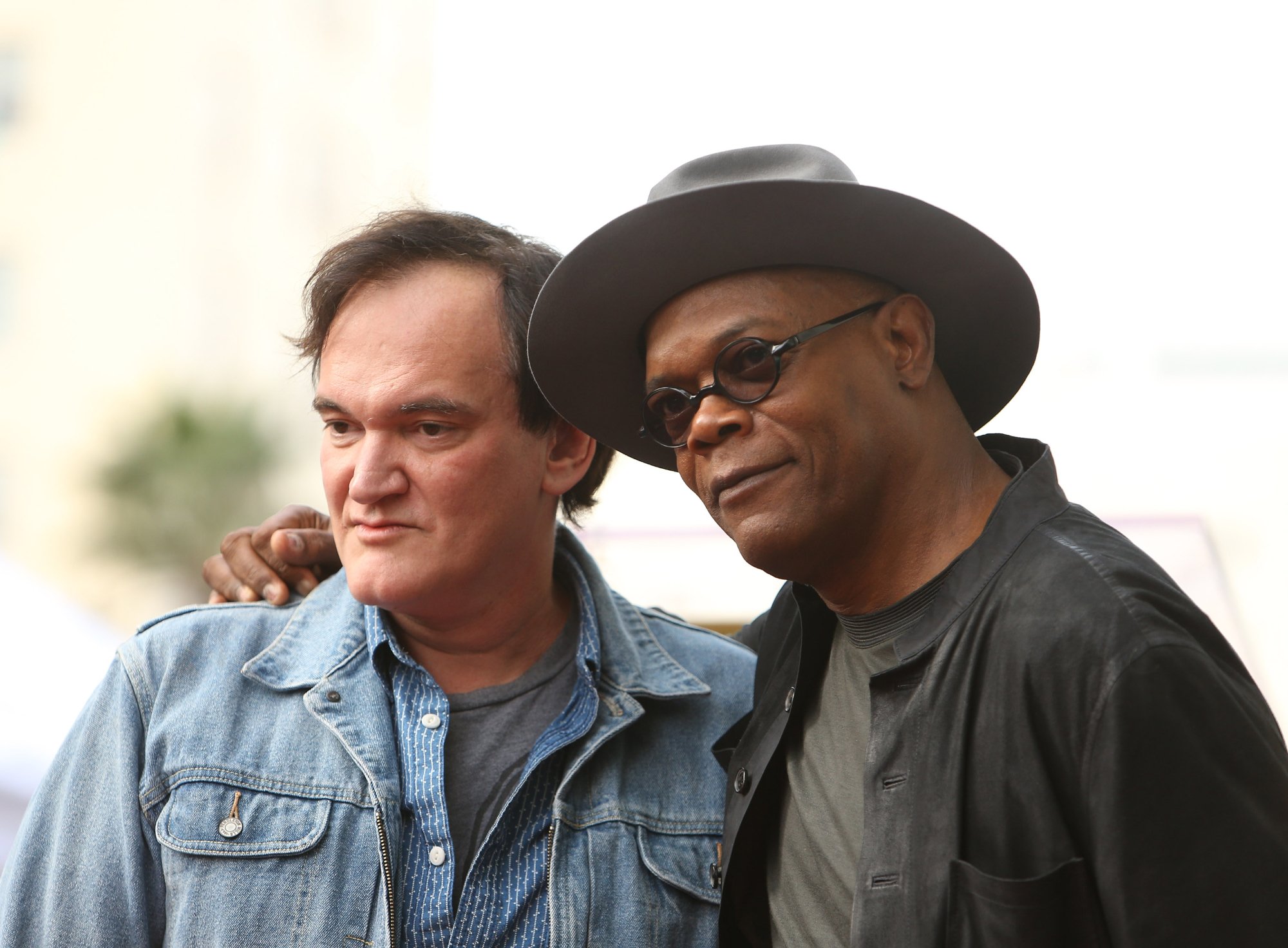 Quentin Tarantino and Samuel L. Jackson with an arm around each other