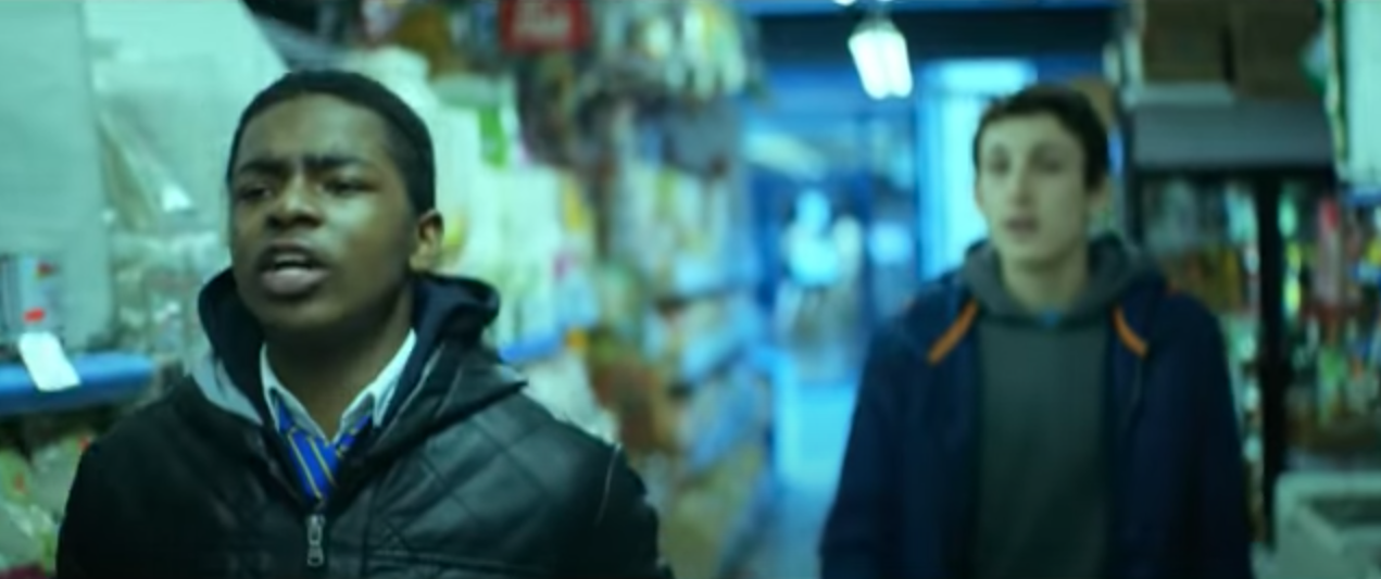 Ra'Nell in the foreground in a convenience store with another boy behind him in 'Top Boy'