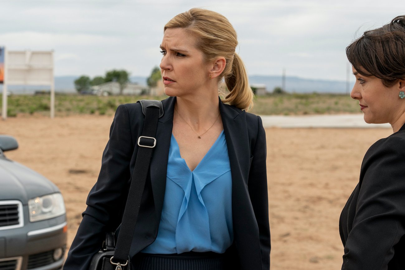 Kim Wexler (Rhea Seehorn) dressed in blue turning her head away from a colleague in season 5 of 'Better Call Saul'