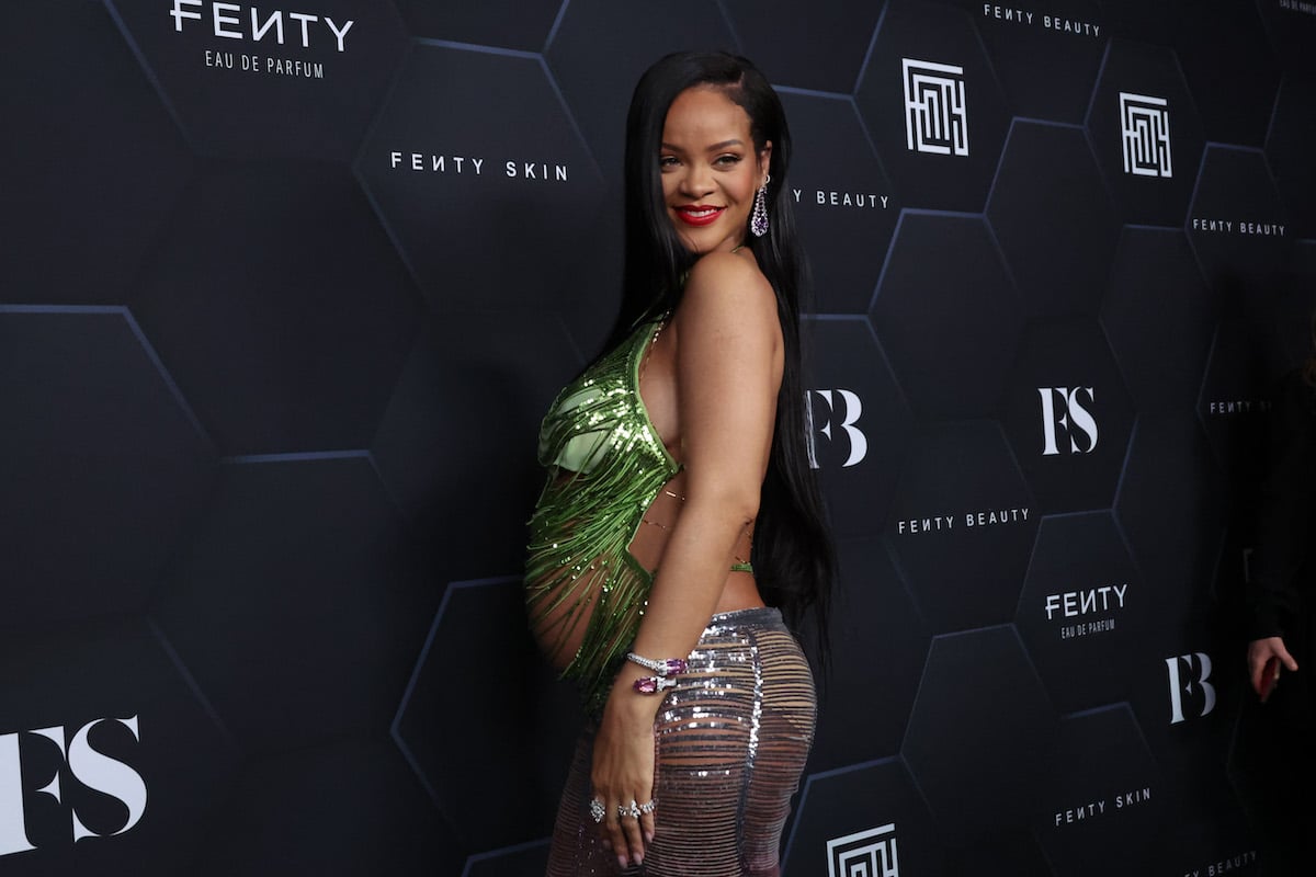 A pregnant Rihanna poses for a picture as she celebrates her beauty brands fenty beauty and fenty skin