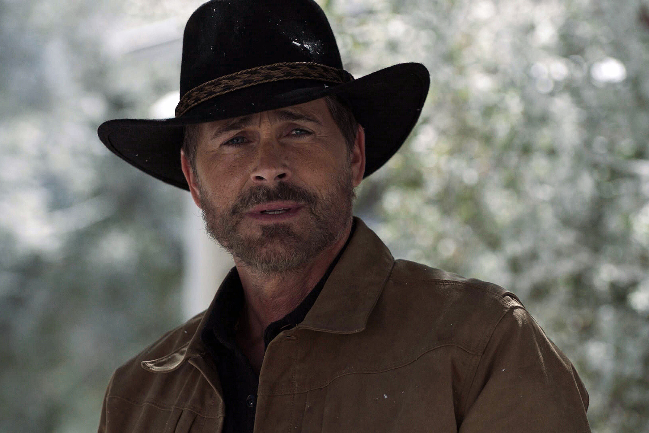 A close-up of Rob Lowe wearing a hat in Rob Lowe in '9-1-1: Lone Star' Season 3