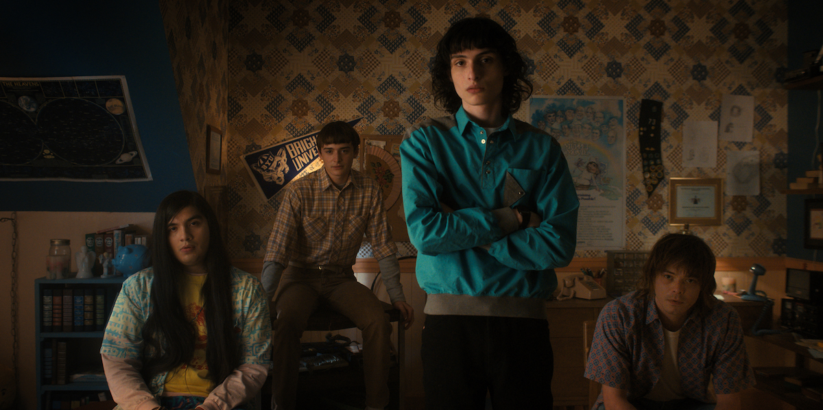'Stranger Things' Season 4 shows Suzie's room in a production still featuring Eduardo Franco, Noah Schnapp, Finn Wolfhard, and Charlie Heaton