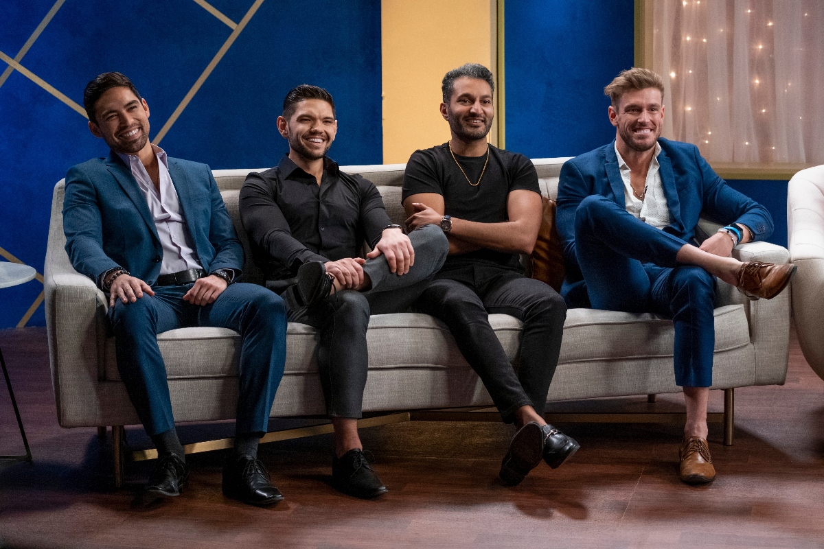 Salvador, 'Sal' Perez, Kyle Abrams, Shake Chatterjee, and Shayne Jansen smiling and sitting together on a couch during the 'Love Is Blind' reunion episode.