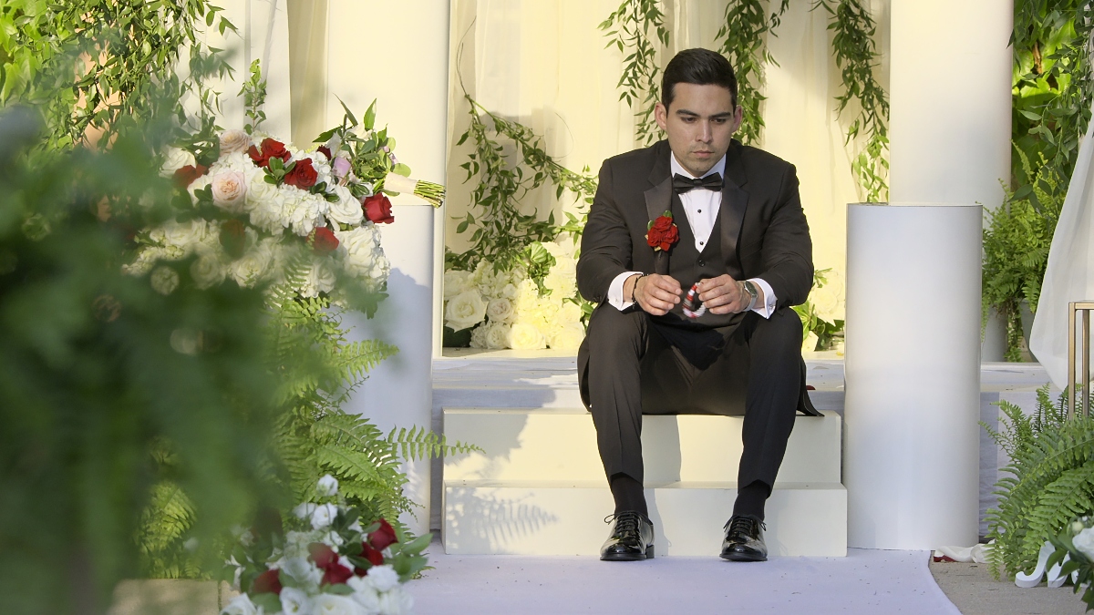 Salvador 'Sal' Perez sitting on step at his wedding wearing a tuxedo on 'Love Is Blind’ 