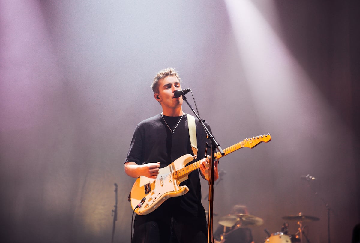 Sam Fender performing on stage