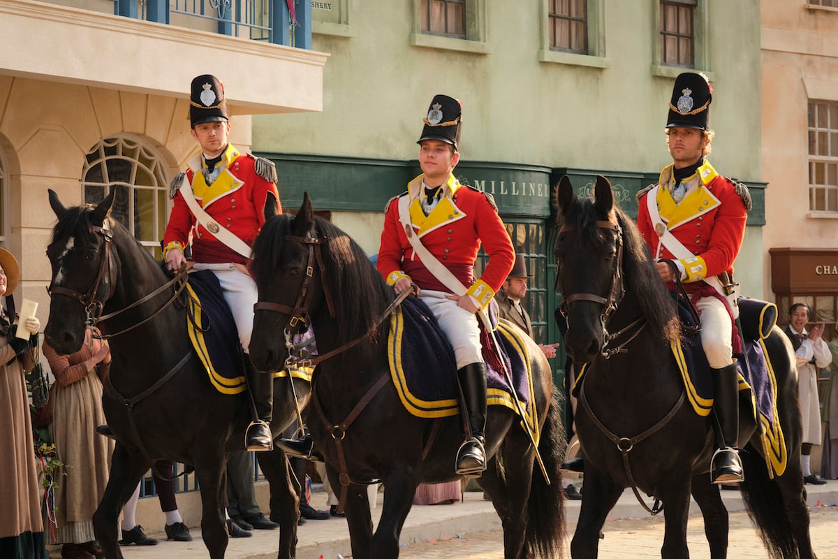 Three army officers in red coats on horses in 'Sanditon' Season 2
