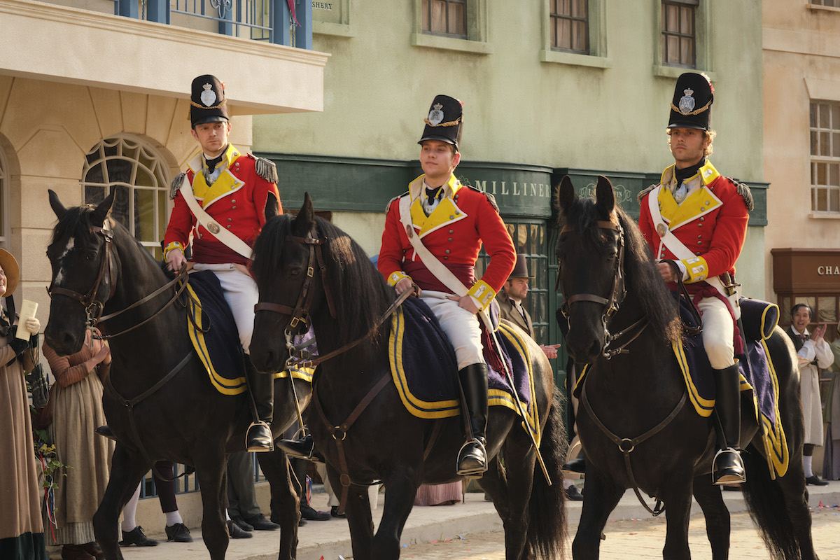 Three army officers in red coats on horses in 'Sanditon' Season 2