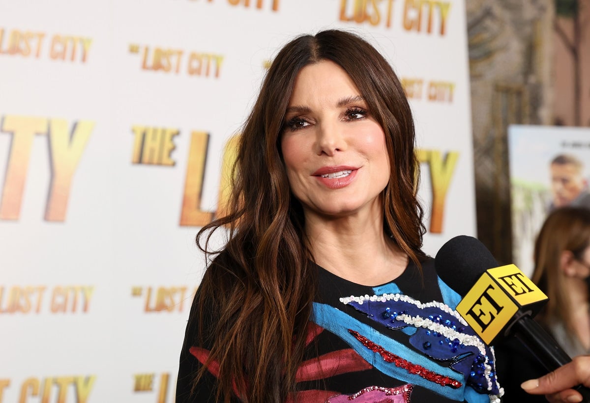 Sandra Bullock, who owns Beverly Hills and Malibu mansions, is interviewed on the red carpet at a screening of ‘The Lost City’