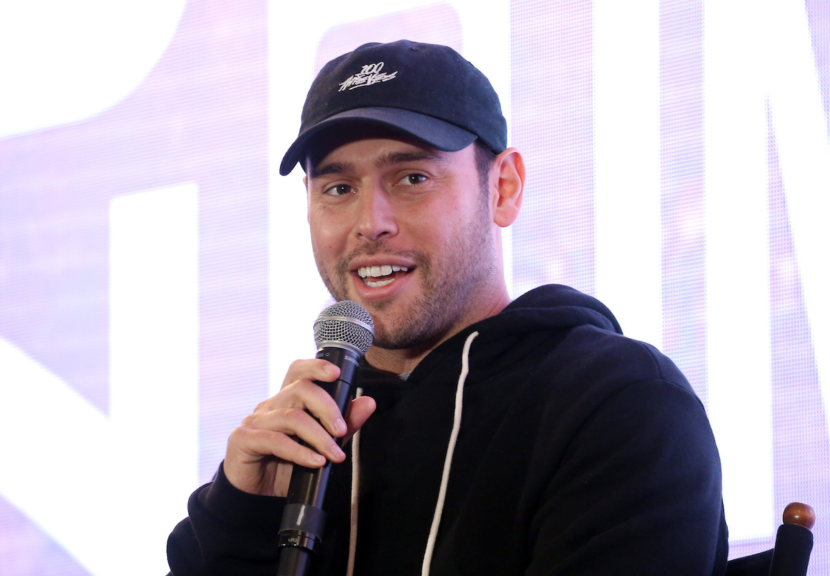 Scooter Braun speaks into a microphone.