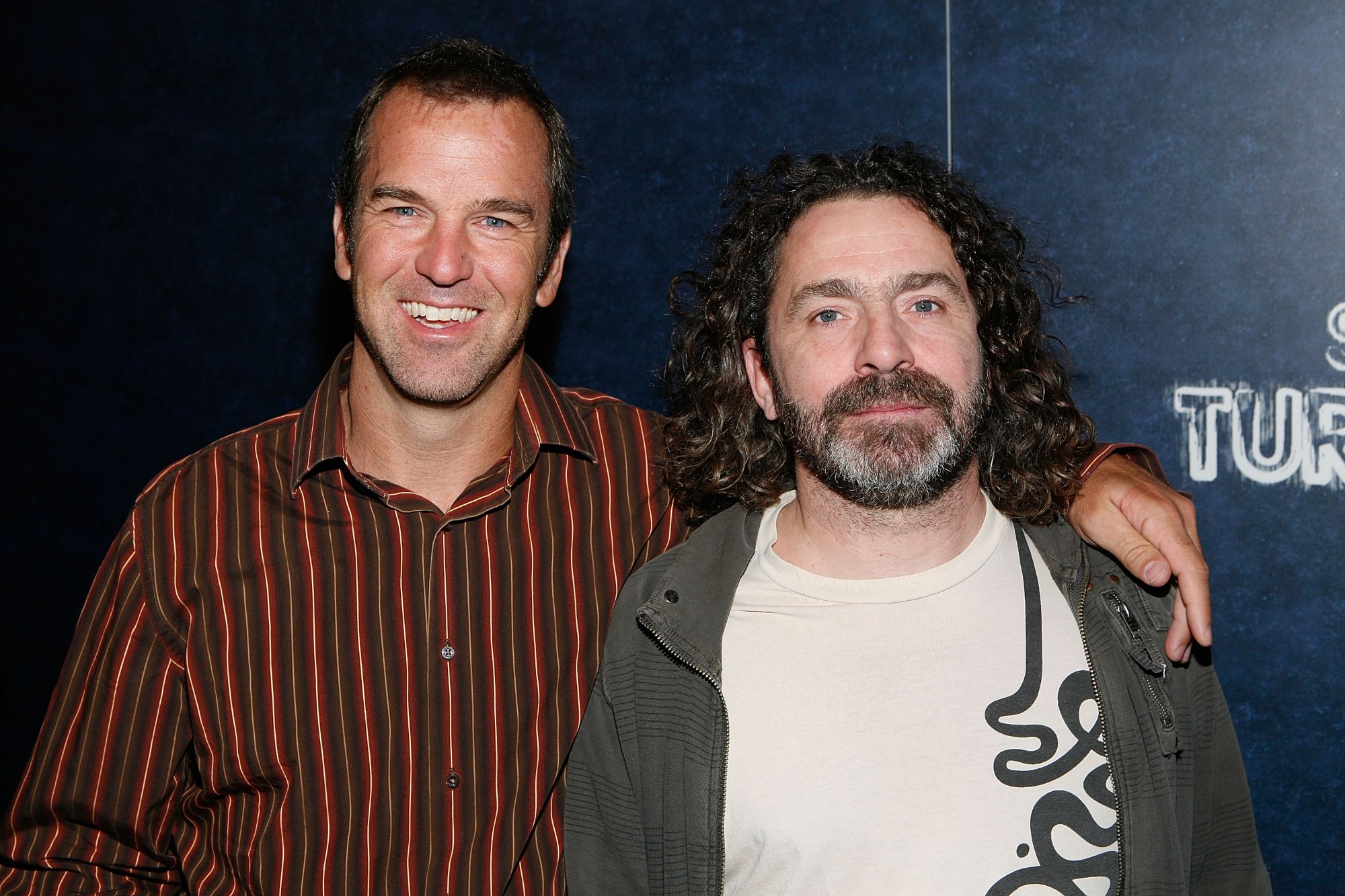 Scott Rogers and Jaque Paquin at event for 'Spider-Man Turn Off The Dark' in front of a step and repeat