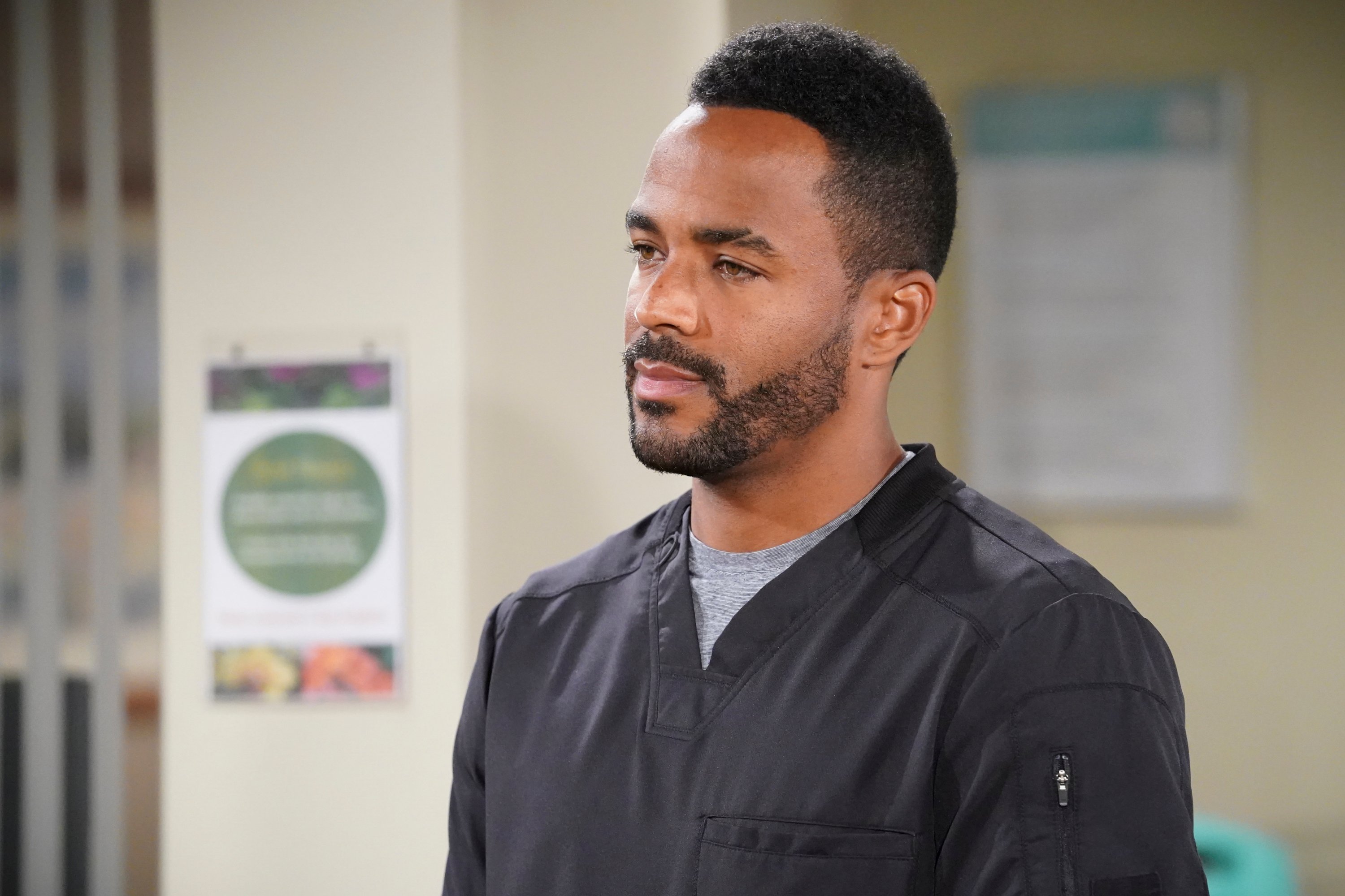 'The Young and the Restless' actor Sean Dominic wearing black scrubs during a hospital scene from the soap opera.