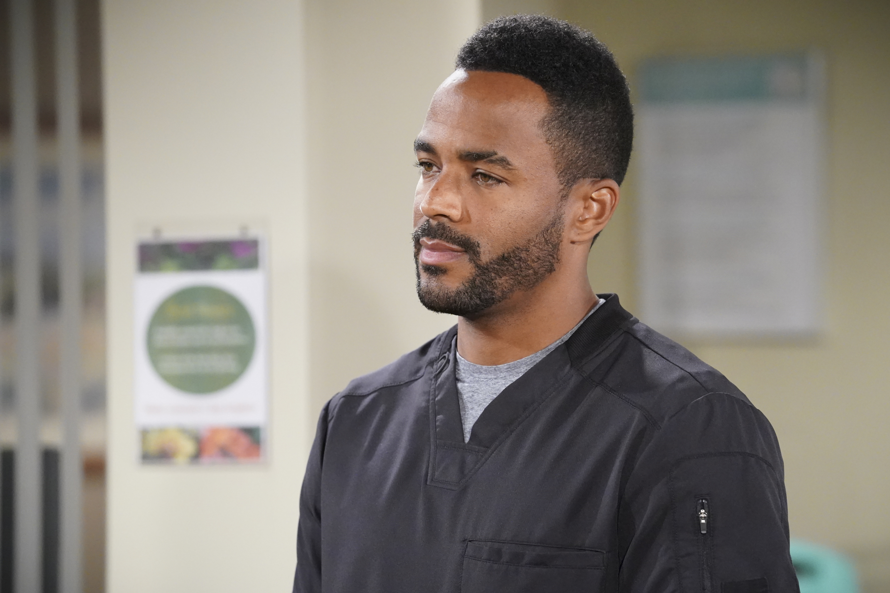 'The Young and the Restless' actor Sean Dominic wearing black scrubs during a hospital scene from the soap opera.