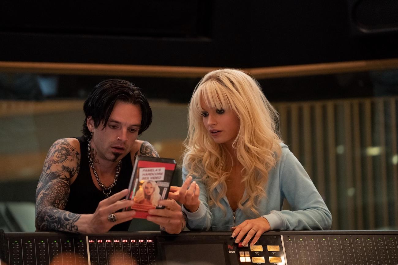 Tommy Lee (Sebastian Stan) and Pam Anderson (Lily James) study the infamous sex tape in an episode of Hulu's 'Pam and Tommy'