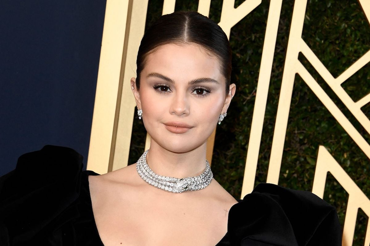 Selena Gomez wears a black gown and a diamond snake choker.