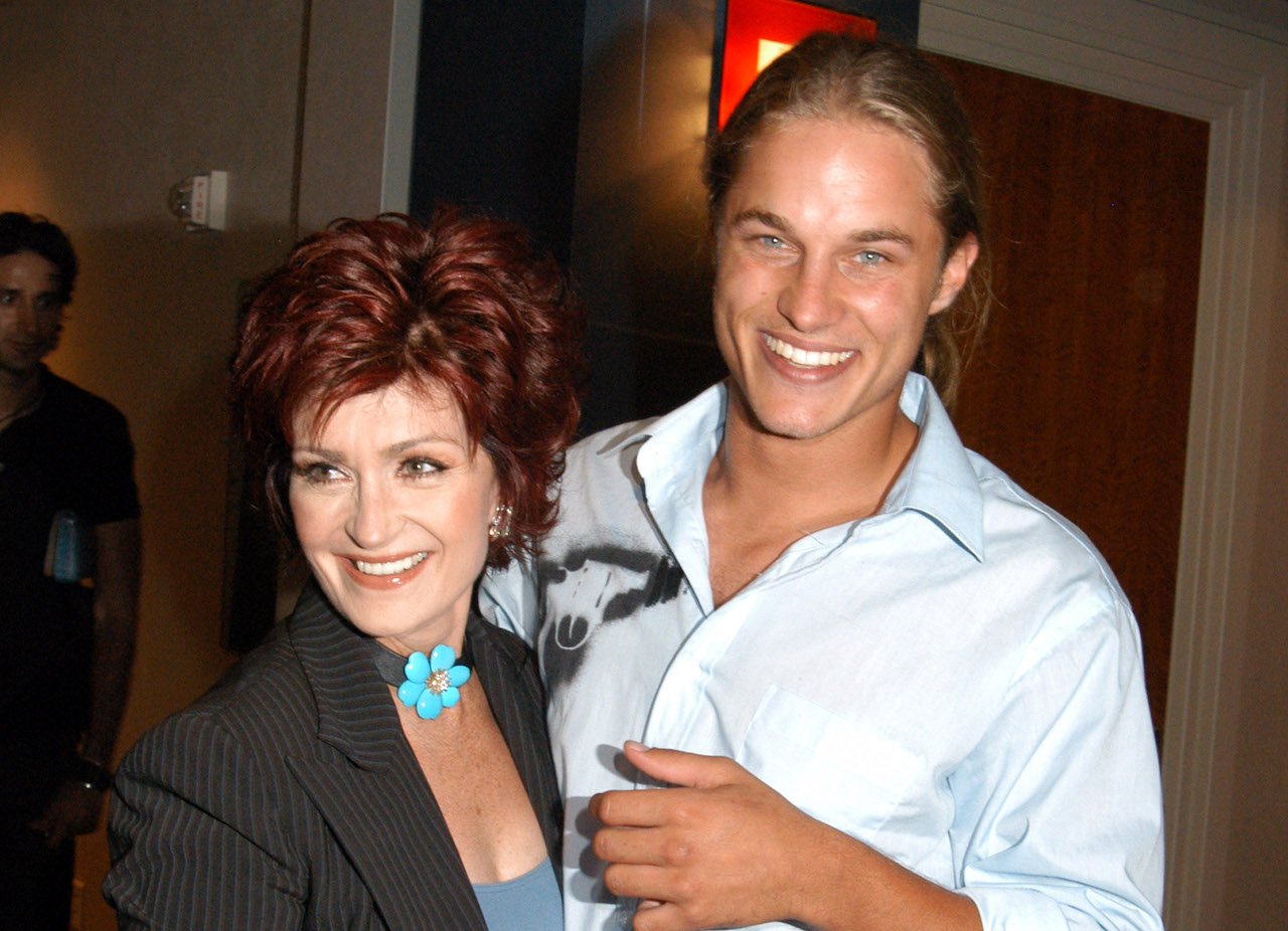 (L-R) Sharon Osbourne and Travis Fimmel pose together c. 2003