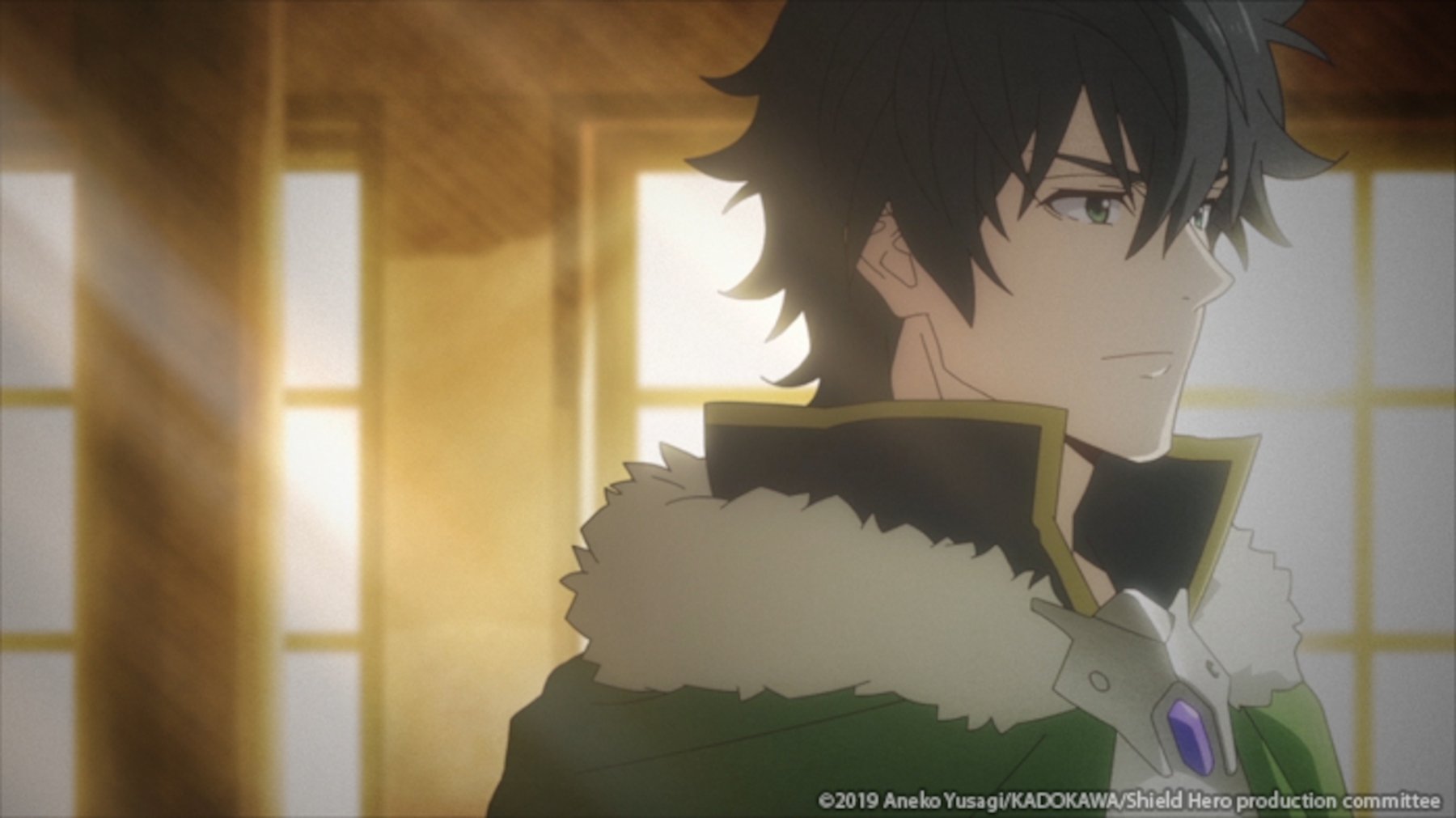 Naofumi Iwatani in 'The Rising of the Shield Hero.' He's wearing a green cloak with white fur on the top.