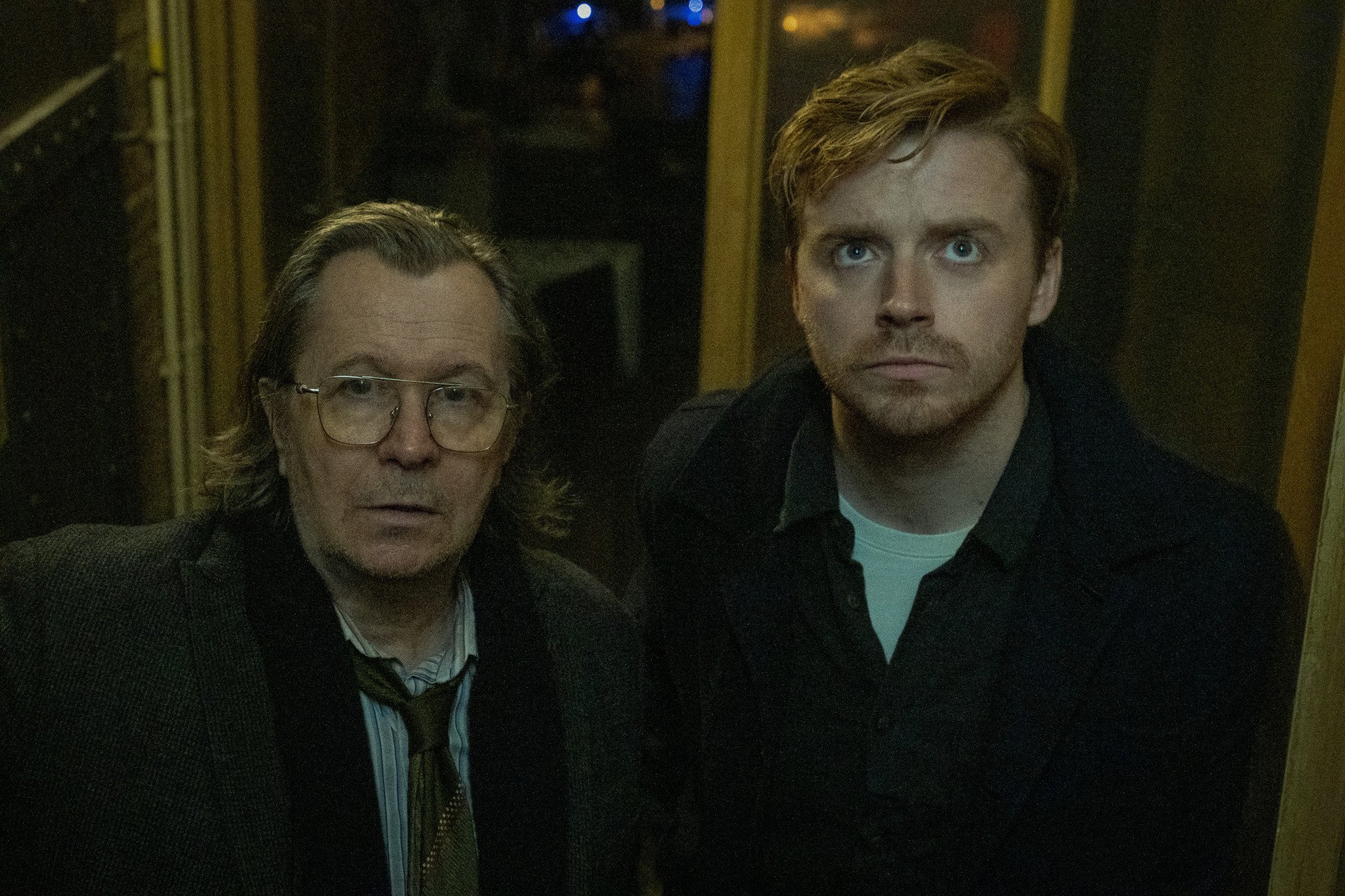 Gary Oldman and Jack Lowden in 'Slow Horses.' They're standing next to one another and looking up.