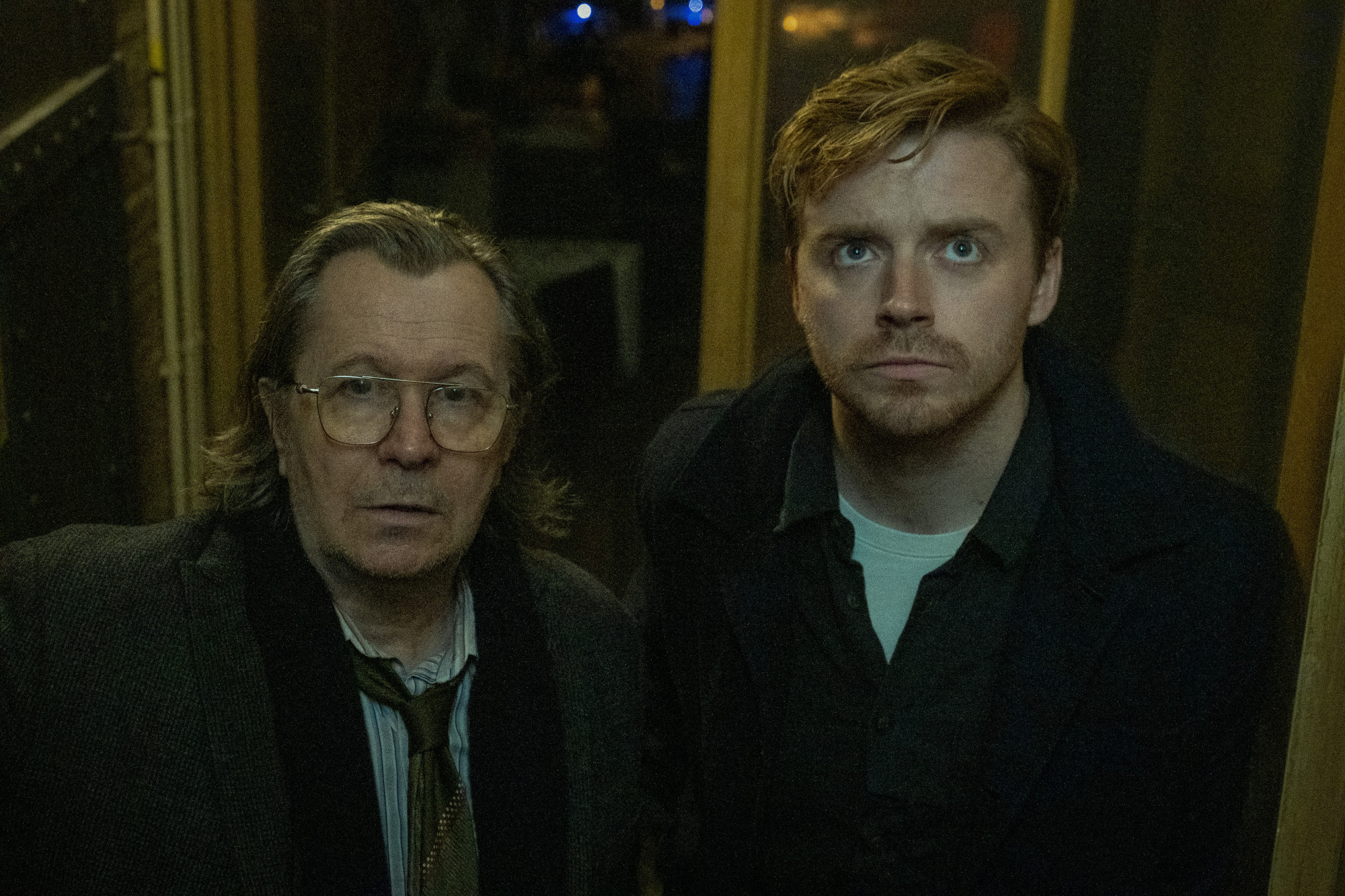 Gary Oldman and Jack Lowden in 'Slow Horses.' They're standing next to one another and looking up.