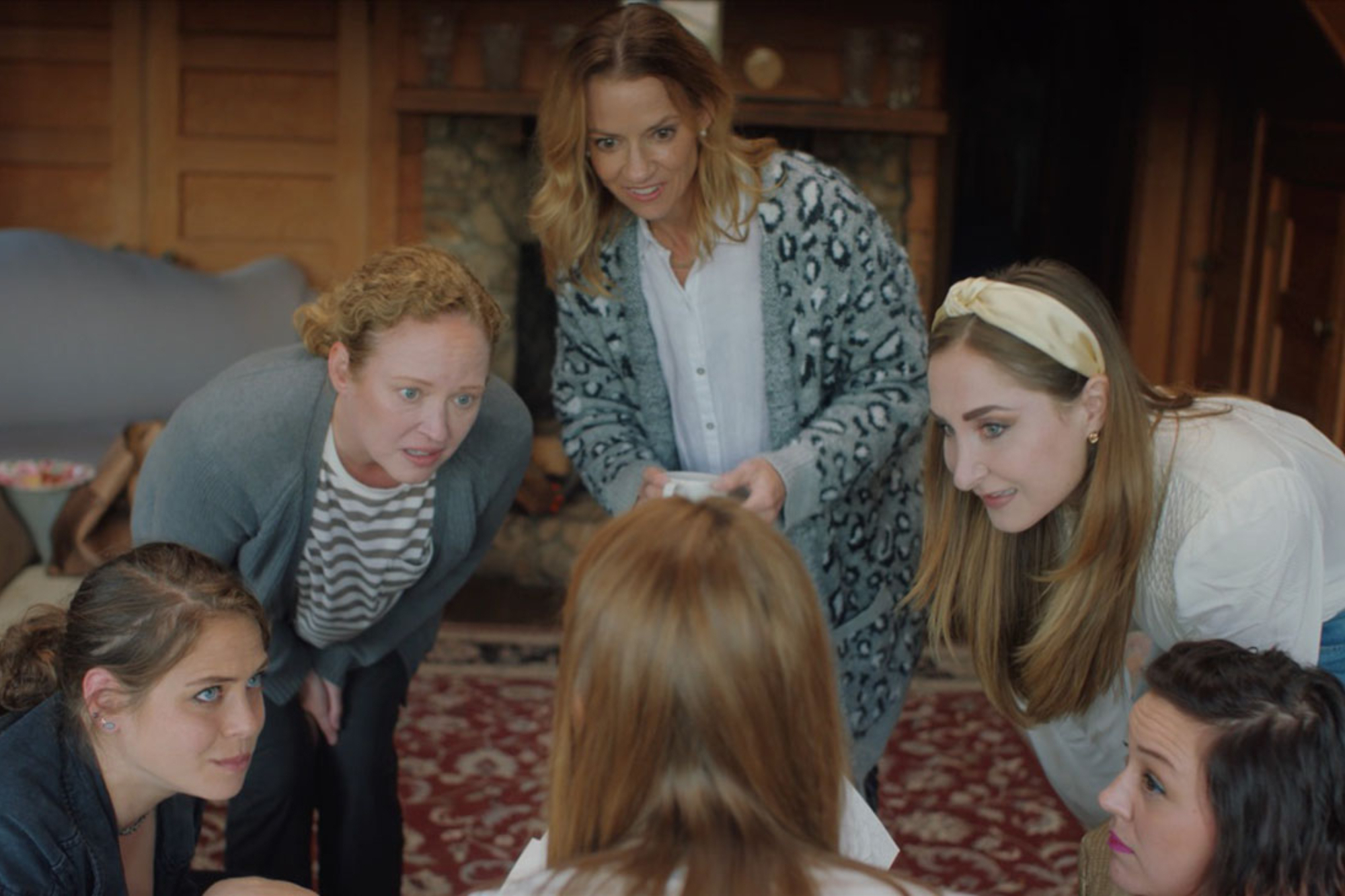 'Soft & Quiet' Olivia Luccardi as Leslie, Dana Millican as Kim, Shannon Mahoney as Jessica, Rebekah Wiggins as Alice, Eleanore Pienta as Marjorie, and Stefanie Estes as Emily sitting in a circle smiling while standing on a large rug