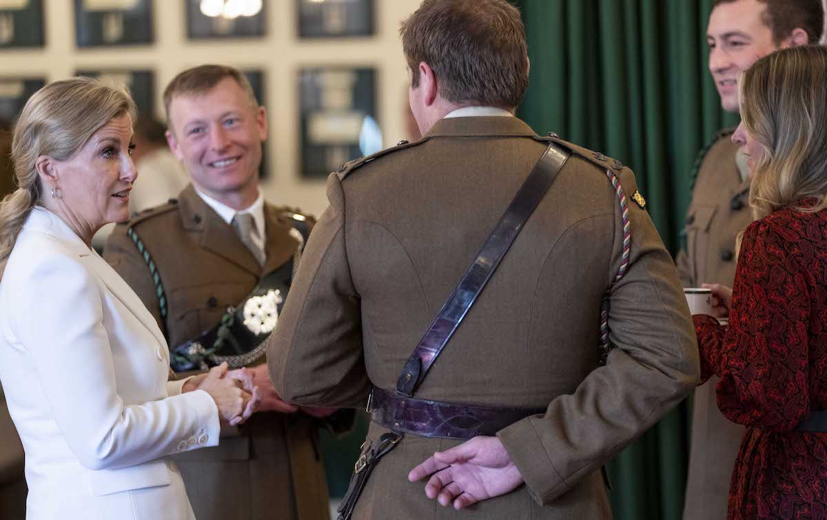 Sophie, Countess of Wessex stands in a circle and speaks to four people during a visit to 5 Rifles