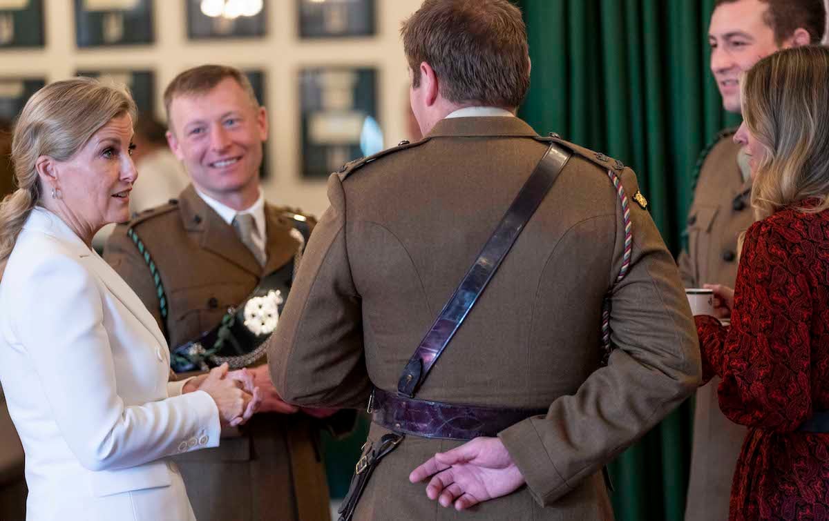 Sophie, Countess of Wessex stands in a circle and speaks to four people during a visit to 5 Rifles