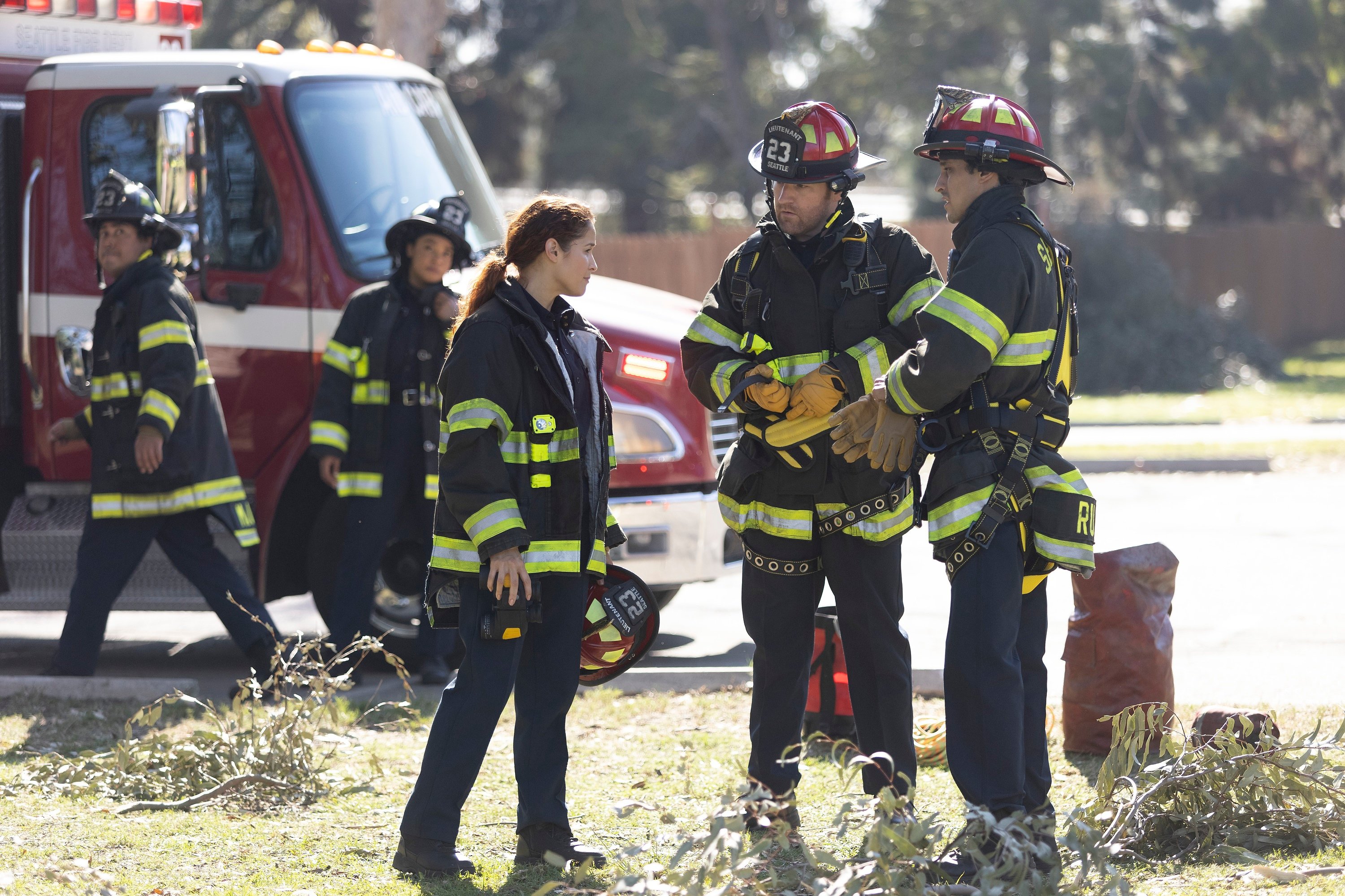 'Station 19' Jaina Lee Ortiz as Andy Herrera in her fire gear with several other fire fighters