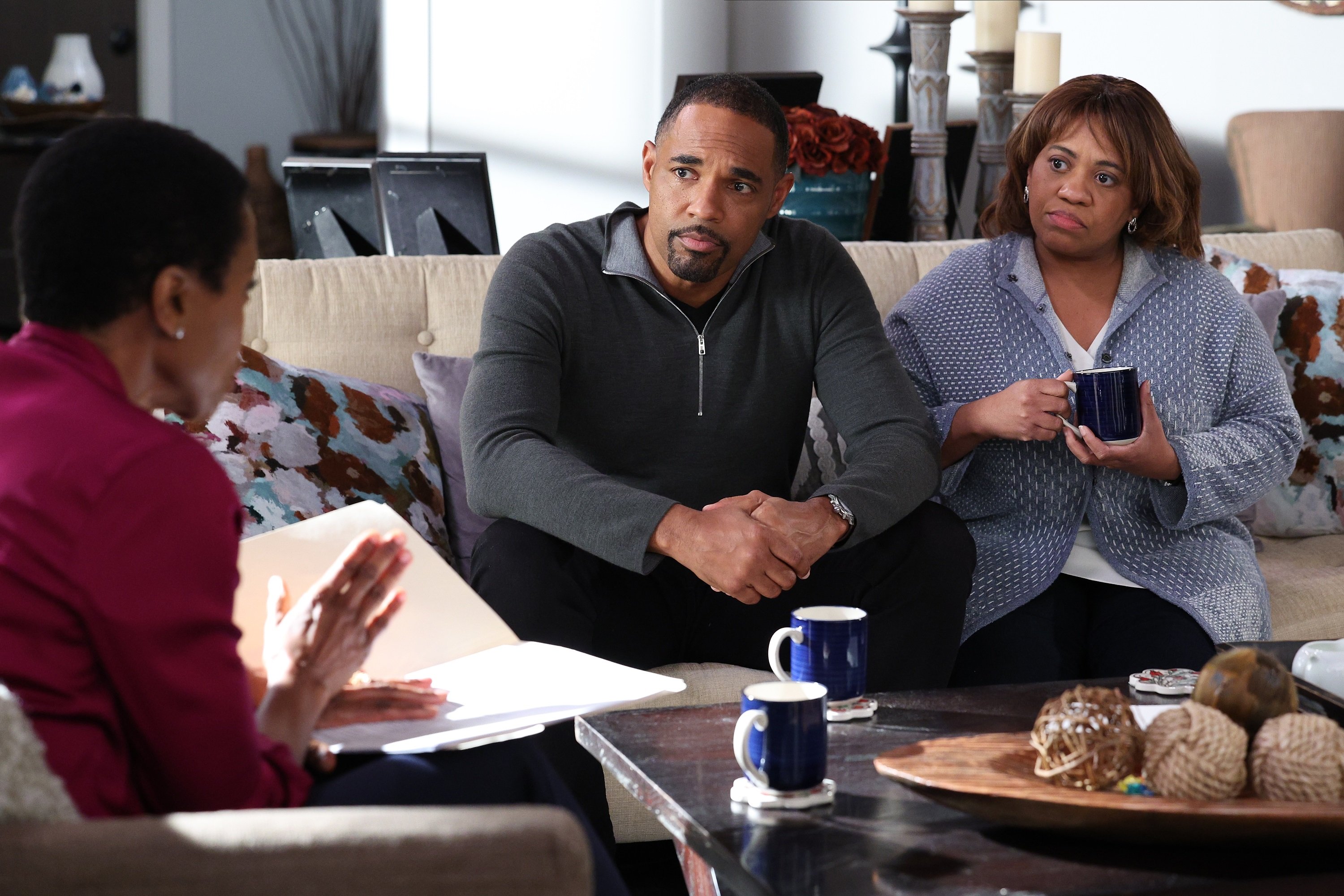 'Station 19' Episode 13 Jason George and Chandra Wilson portray Ben and Miranda sitting on a couch talking to Pru's grandparents