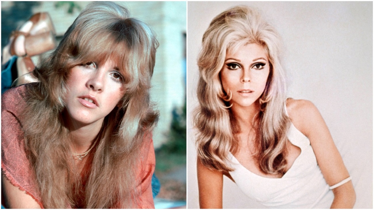 Stevie Nicks wears a pink shirt and lays on her stomach. Nancy Sinatra wears a white shirt and leans on her elbow.