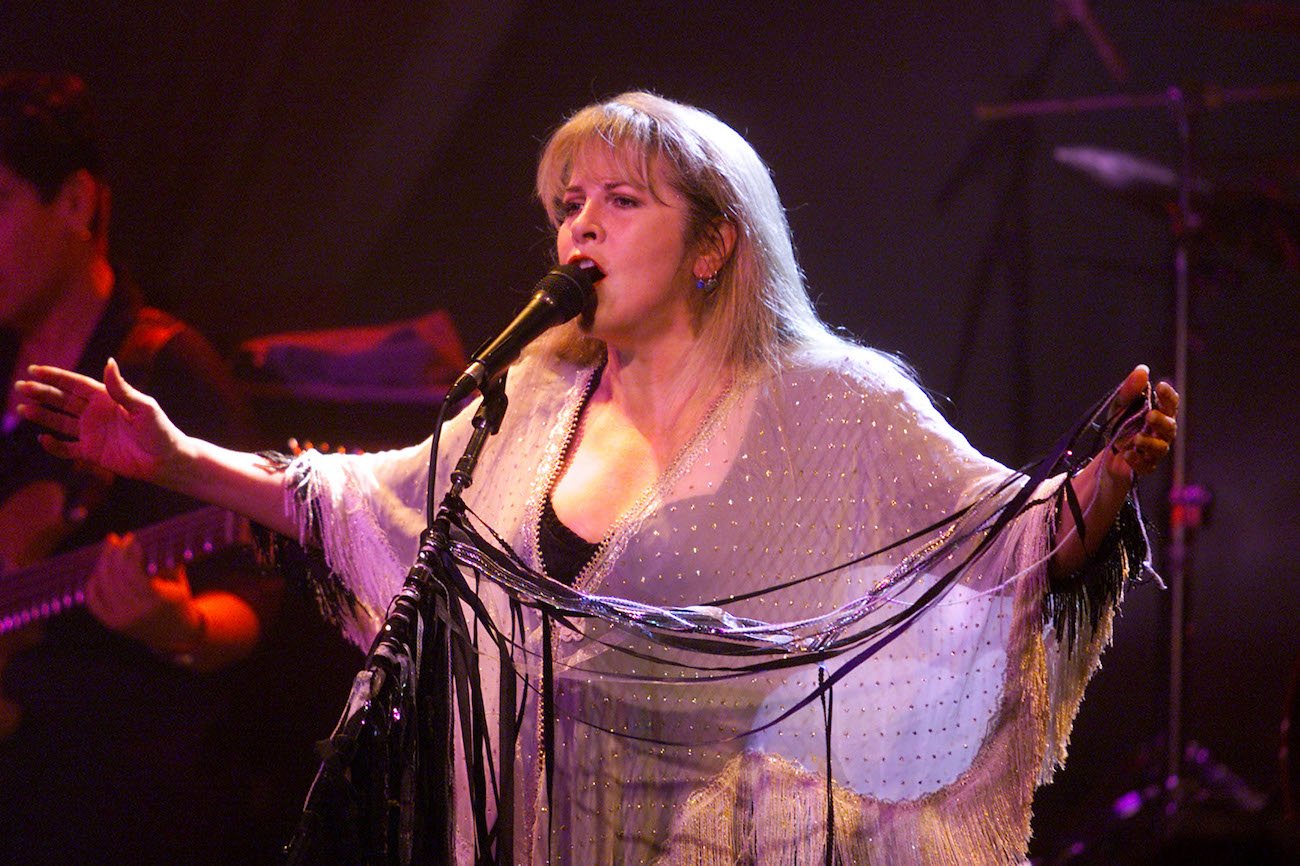 Stevie Nicks performing in a white shawl in 2001.
