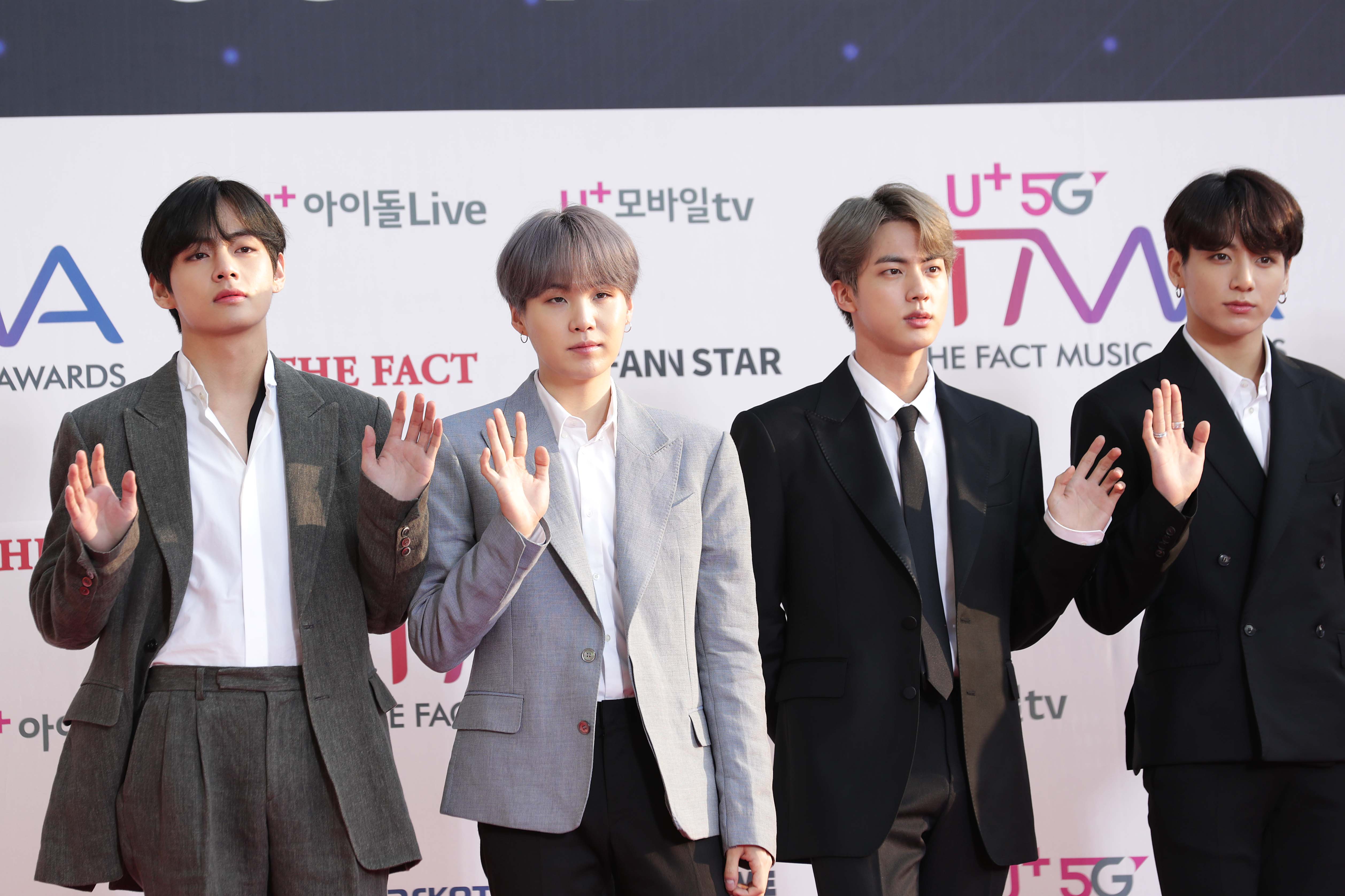 Suga, Jin, and JungKook of boy band BTS attend the photocall for U Plus 5G 'The Fact Music Awards'
