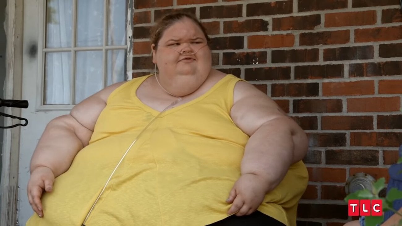 Tammy Slaton sits outside on her porch in an episode of '1000-lb Sisters'