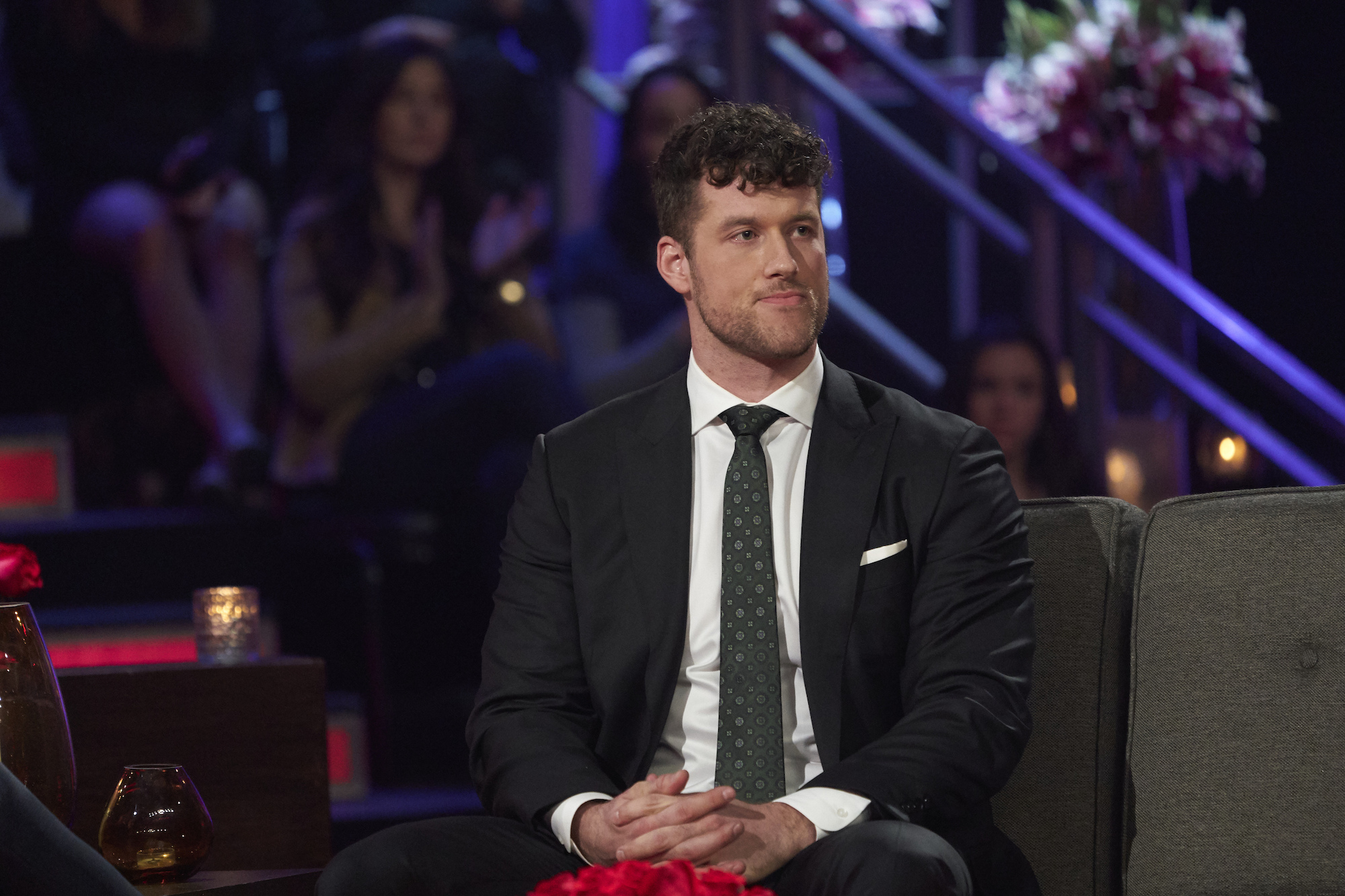 'The Bachelor' star Clayton Echard wearing a suit while on stage at the 'Women Tell All.'